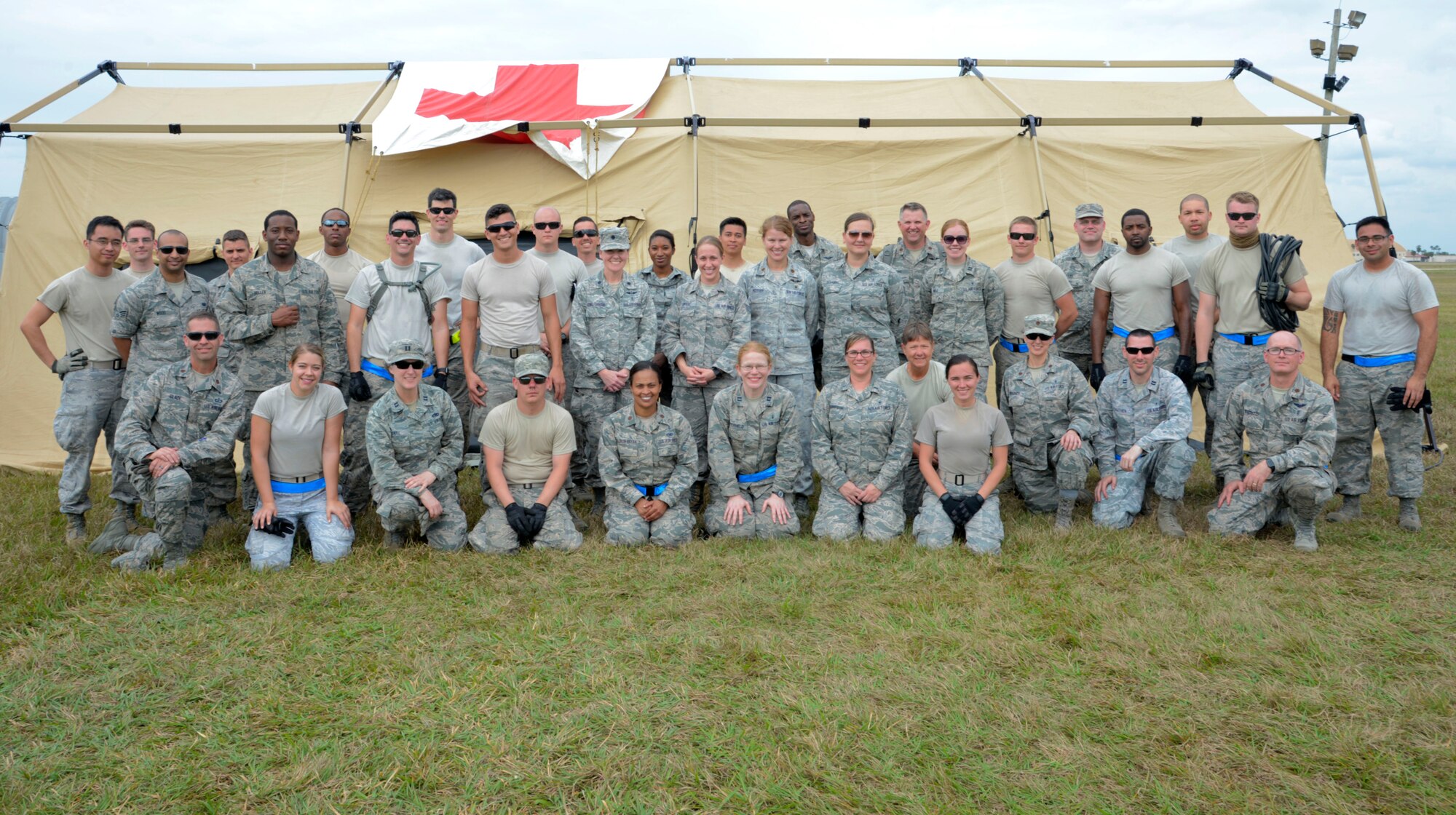 Members from the 6th Medical Group pause for a group photo after a two-day aeromedical evacuation exercise at MacDill Air Force Base, Fla., March 12, 2017. Participants learned to effectively utilize manpower, care space and communication to provide effective and efficient patient care and transport. (U.S. Air Force photo by Senior Airman Tori Schultz)