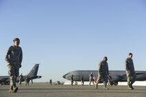 Members of the 940th Air Refueling Wing look for foreign object debris on the flightline March 12, 2017, at Beale Air Force Base, California. Airmen gathered to ensure the KC-135 Stratotanker area of the flightline was free of any FOD. (U.S. Air Force photo by Senior Airman Tara R. Abrahams)