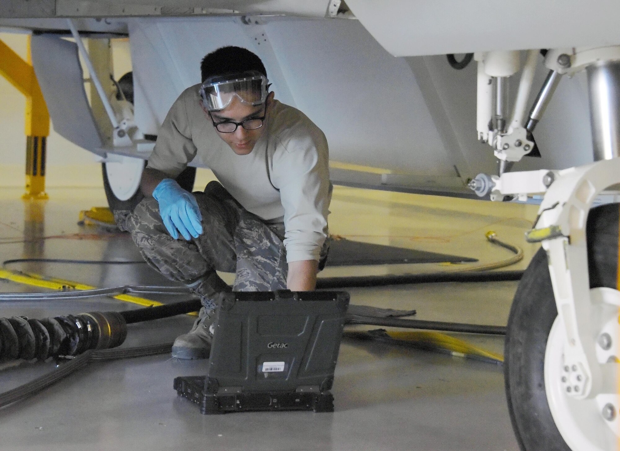 Airman Jacob Rebolloso, 362nd Training Squadron F-22 Raptor crew chief student, operates a portable maintenance aid, to connect and apply aircraft power. The students in this course are taught with hands-on techniques they are then able to apply to an $8 million F-22 Raptor trainer. (U.S. Air Force photo by Liz H. Colunga/Released)