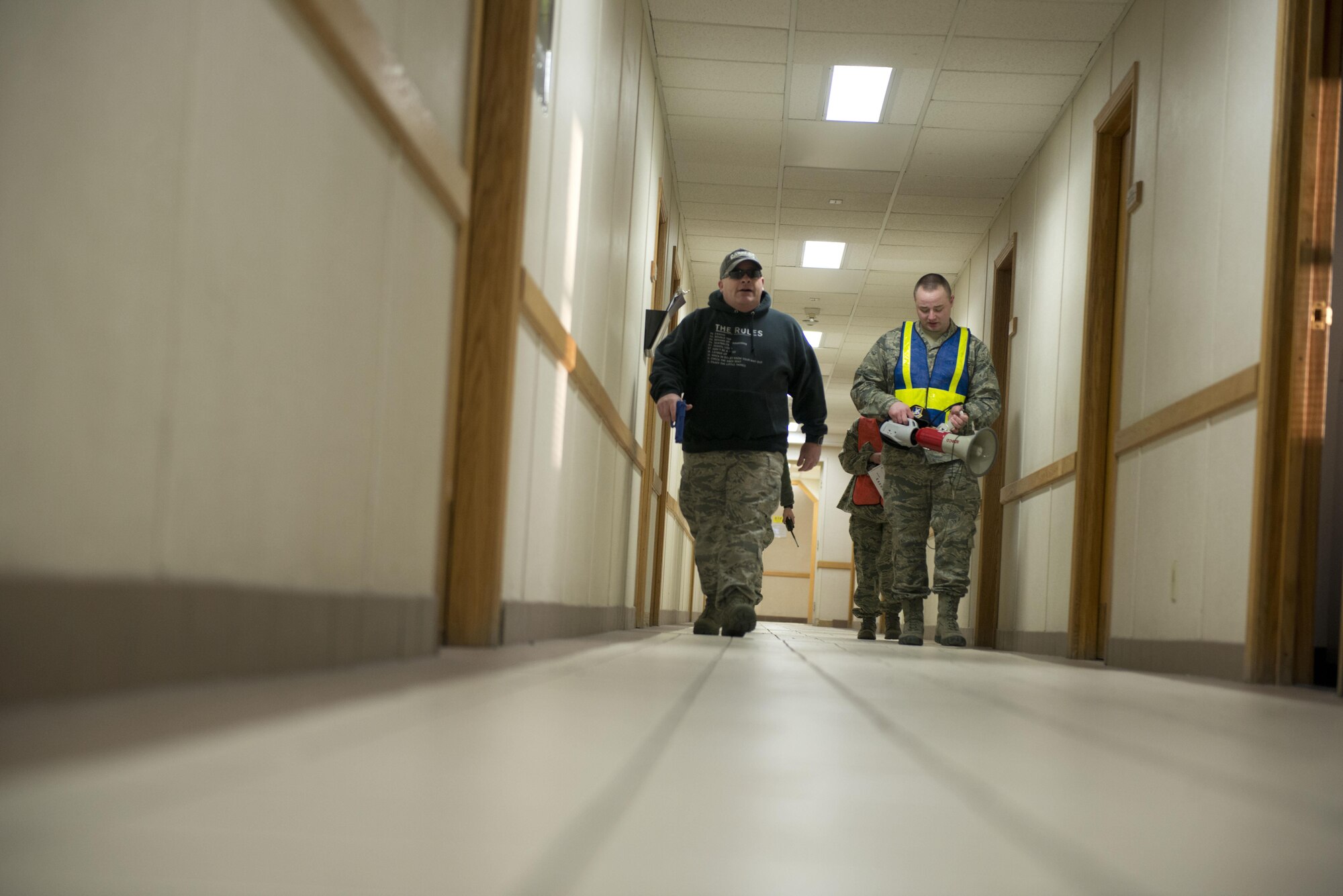 Air Force Master Sergeant Daniel Chrisco, an active shooter exercise player searches the halls of the 773rd Civil Engineer Squadron for unlocked office doors during an exercise March 13. The Security Forces Squadron on Joint Base Elmendorf-Richardson conducts regular no-notice tests of offices’ active shooter mentalities around base.