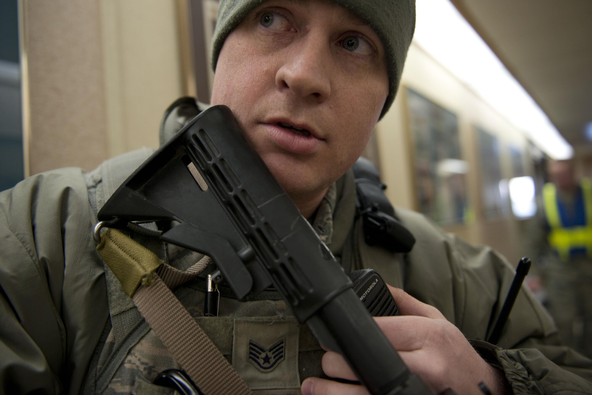 Air Force Staff Sgt. Nicholas Woolridge, a patrolman with the 673d Security Forces Squadron watches the hallway as his co-worker pins down and detains the active shooter player in the 773rd Civil Engineer Squadron, March 13. The Security Forces Squadron on Joint Base Elmendorf-Richardson conducts regular no-notice tests of offices’ active shooter mentalities around base.