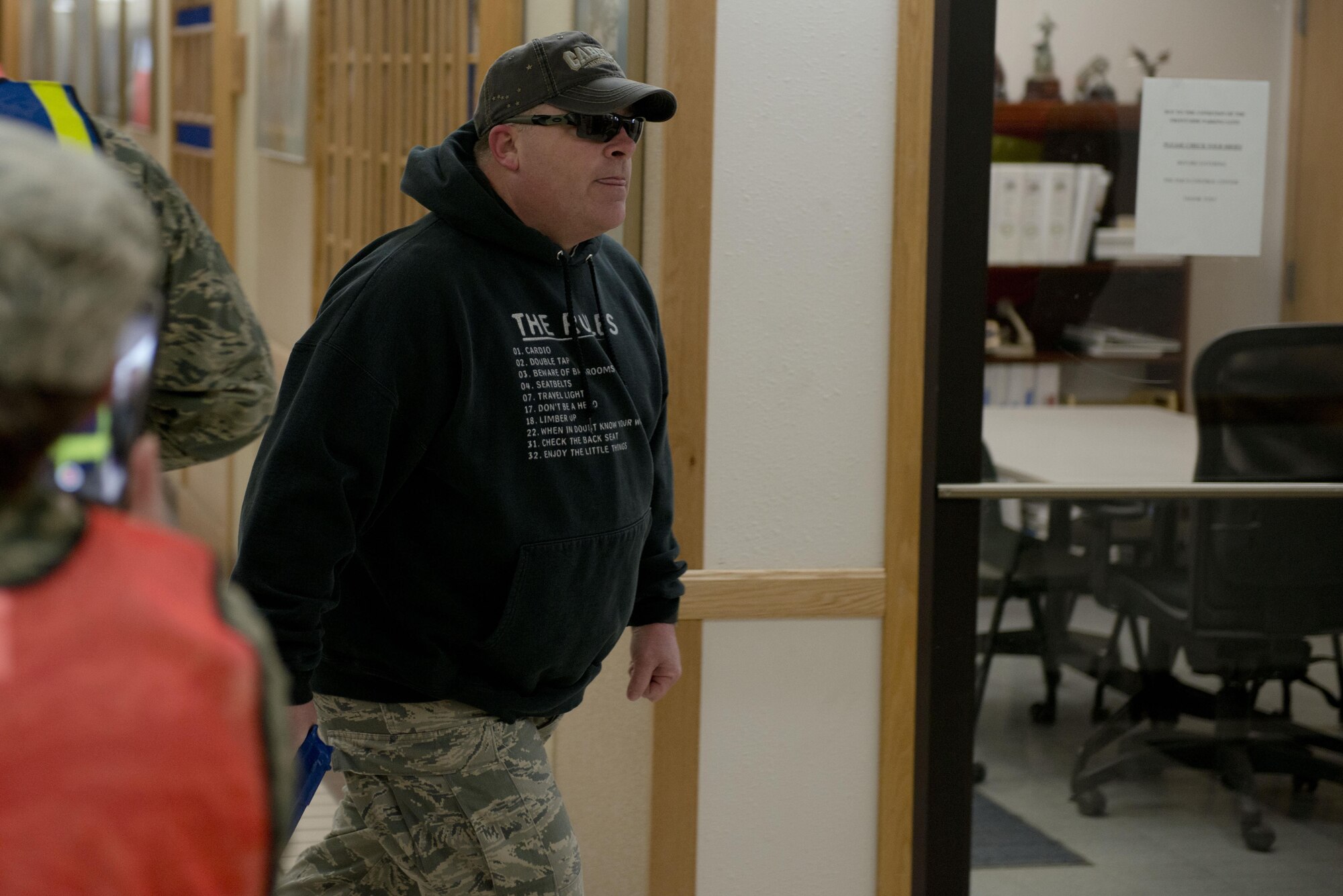 Air Force Master Sergeant Daniel Chrisco, an active shooter exercise player searches the halls of the 773rd Civil Engineer Squadron for unlocked office doors during an exercise March 13. The Security Forces Squadron on Joint Base Elmendorf-Richardson conducts regular no-notice tests of offices’ active shooter mentalities around base.