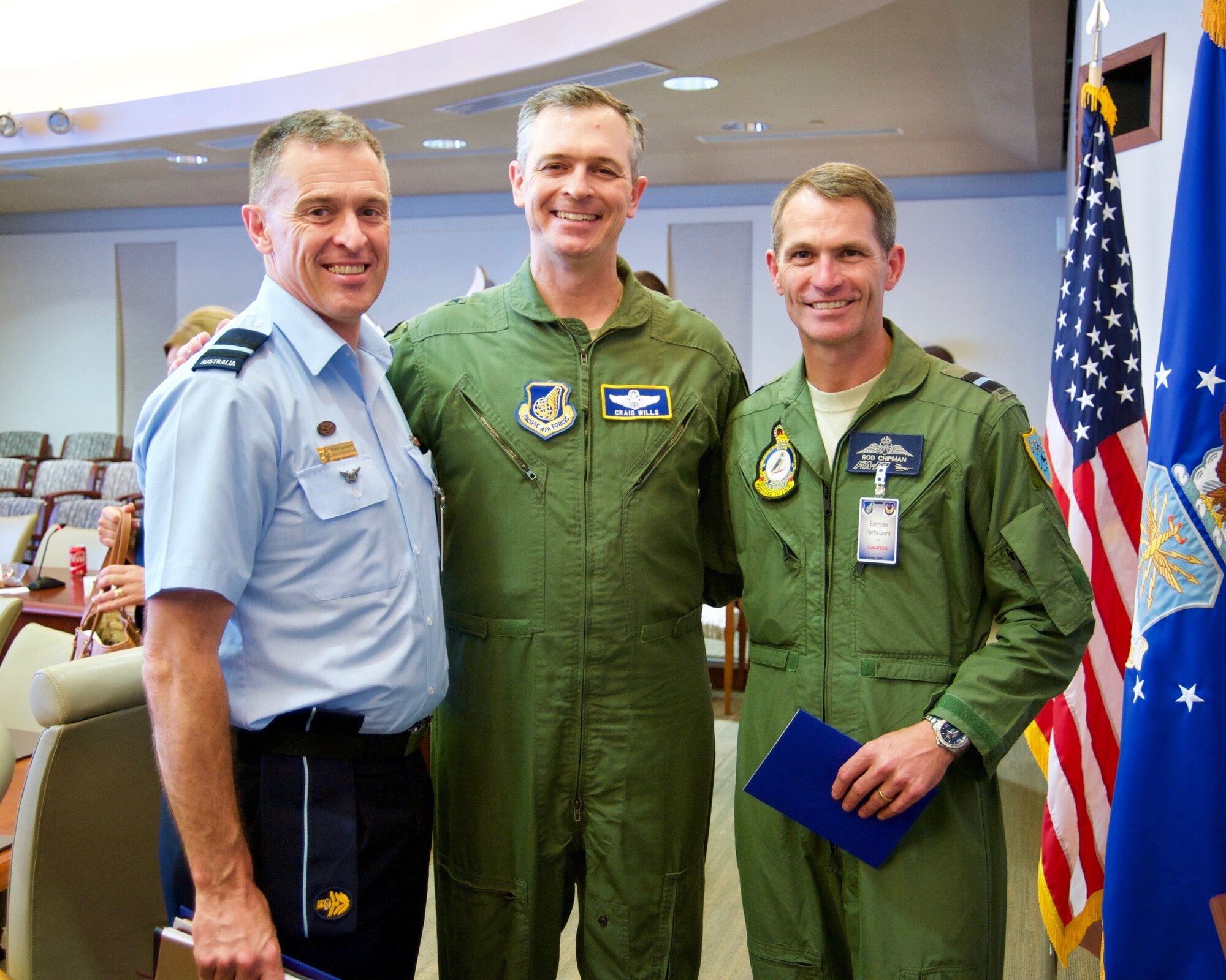 Royal Australian Air Force Air Commodores Terry Saunder (left) and Robert Chipman (right) pose for a group photo with U.S. Air Force Brig. Gen. Craig Wills (center), Pacific Air Forces Strategy, Plans and Programs director, during the Pacific F-35 Symposium at Joint Base Pearl Harbor-Hickam, Hawaii, March 15, 2017. The symposium is a PACAF-hosted event that brings together the four Pacific members of the F-35 program: Japan, Australia, the Republic of Korea and the U.S. While attending the event, senior officers, warfighters and F-35 experts discussed a range of topics related to integrating the F-35 into multilateral air operations in the Indo-Asia-Pacific. The U.S. currently flies the F-35B out of Marine Corps Air Station Iwakuni, Japan, and is scheduled to field two additional squadrons at Eielson AFB, Alaska, starting in 2020. Australia and Japan are already flying their own F-35s and the ROK is projected to receive its first in 2018. (U.S. Air Force photo by Tech. Sgt. James Stewart)