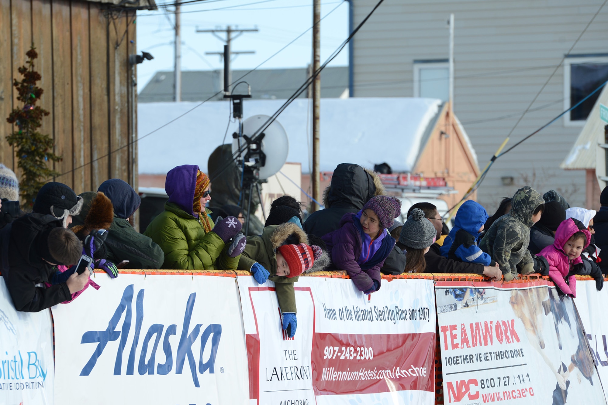 Children wait in anticipation for Mitch Seavey, the first-place winner of the 45th Iditarod Trail Sled Dog Race, in Nome, Alaska, March 14, 2017. Nome hosts the finish line of Alaska’s Last Great Race, sometimes referred to as the ‘Mardi Gras of the North,’ and approximately 1,000 people arrive in Nome to participate in the event.