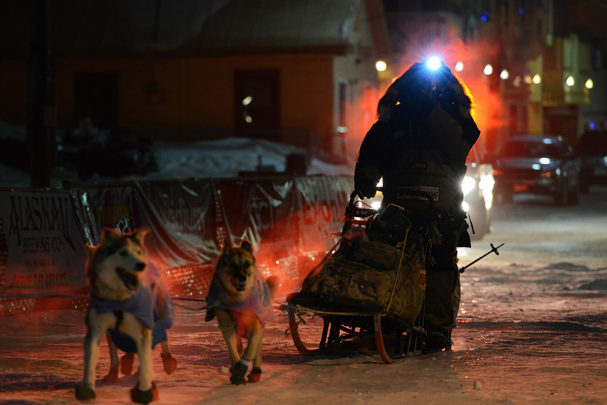 Rick Casillo, Battle Dogs founder and Iditarod Trail Sled Dog Race veteran, mushes to the finish line in Nome, Alaska, March 15, 2017. The Iditarod is an annual 1,000-mile race challenging mushers and dog teams alike under cold weather conditions and long distance travel to the finish line in Nome. 