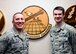 Maj. James Spoo, 741st Maintenance Squadron commander, left, and Staff Sgt. Jacob, 741st MXS missile maintenance operations center senior controller, pose for a photo in the 341st Maintenance Group command section March 15, 2017, at Malmstrom Air Force Base, Mont. Jacob and Tech. Sgt. Lucas, also 741st MXS MMOC, received notification they were two of 30 enlisted Airmen throughout the Air Force to be selected for remotely piloted aircraft pilot training. (U.S. Air Force photo/Senior Airman Magen M. Reeves)