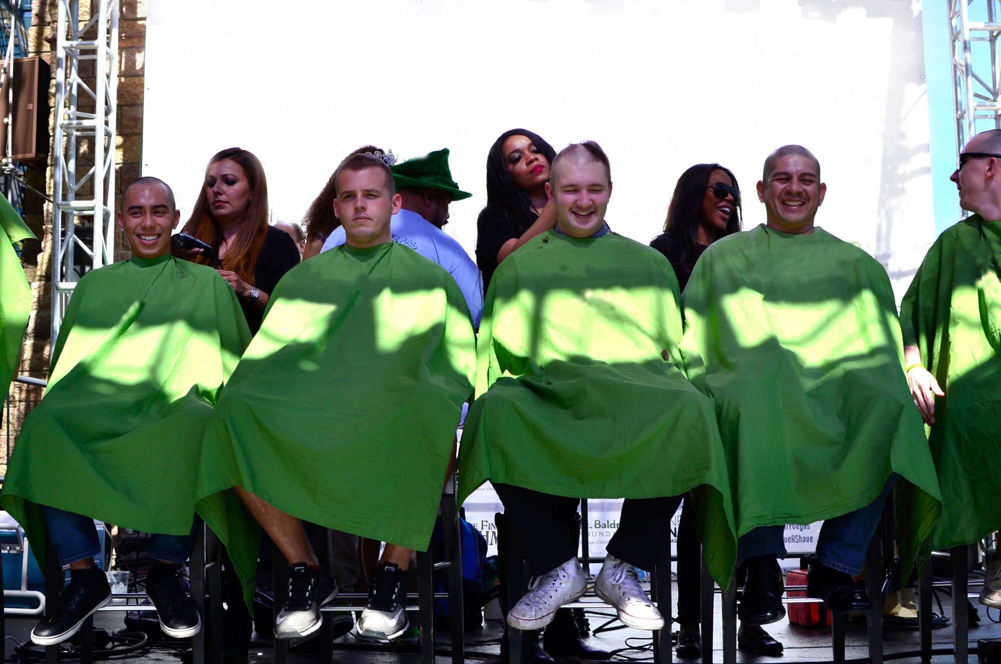 Members of the 15th Attack Squadron get their heads shaved for a fundraiser March 11, 2017, in Las Vegas. The members shaved their heads to show support to children who have been diagnosed with cancer. (U.S. Air Force photo/Senior Airman Christian Clausen)
