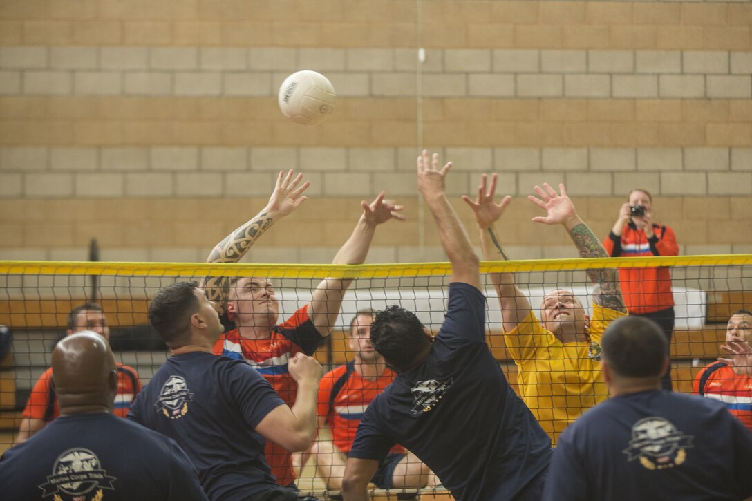 Marine Corps athletes compete in a sitting volleyball match during the 2017 Marine Corps Trials at Camp Pendleton, Calif., March 11, 2017. The event serves as the primary venue to select Marine Corps participants for the DoD Warrior Games. Marine Corps photo by Lance Cpl. Roderick Jacquote