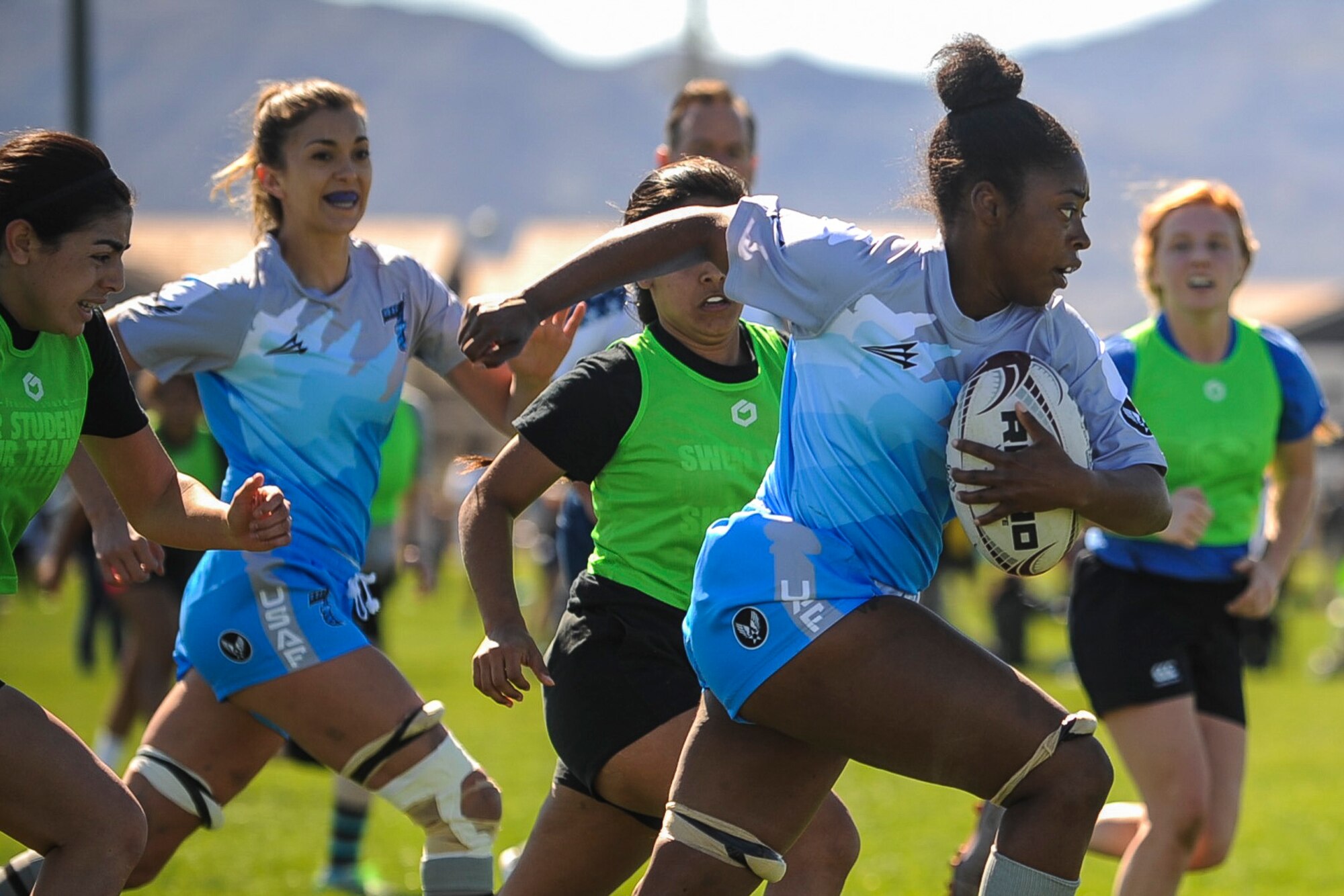 N'Keiah Butler, a wing on the Air Force women’s rugby sevens team, runs with the ball during a Las Vegas Invitational match in Las Vegas, March 2, 2017. Butler was one of 19 women from around the Air Force -- active duty, Guard and Reserve -- who came together to form the service's first official women's rugby team. (U.S. Air Force photo by Staff Sgt. Siuta B. Ika)
