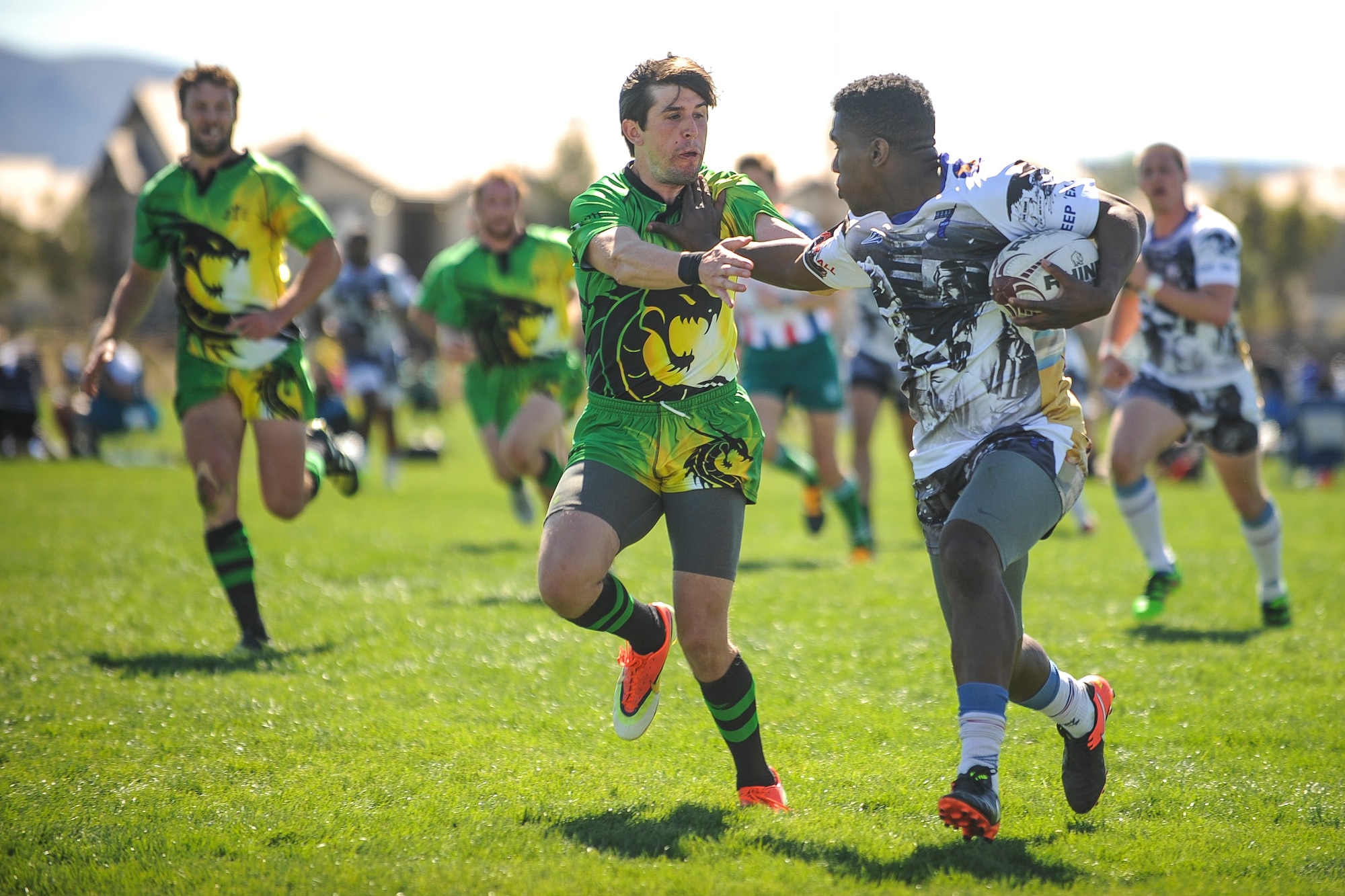 Malcolm Gilliam, a wing on the Air Force men’s rugby sevens team, stiff arms a defender during a Las Vegas Invitational match in Las Vegas, March 2, 2017. The tournament marked the first game action of the Air Force rugby program’s season, which will culminate in the Armed Forces Championship. (U.S. Air Force photo by Staff Sgt. Siuta B. Ika)