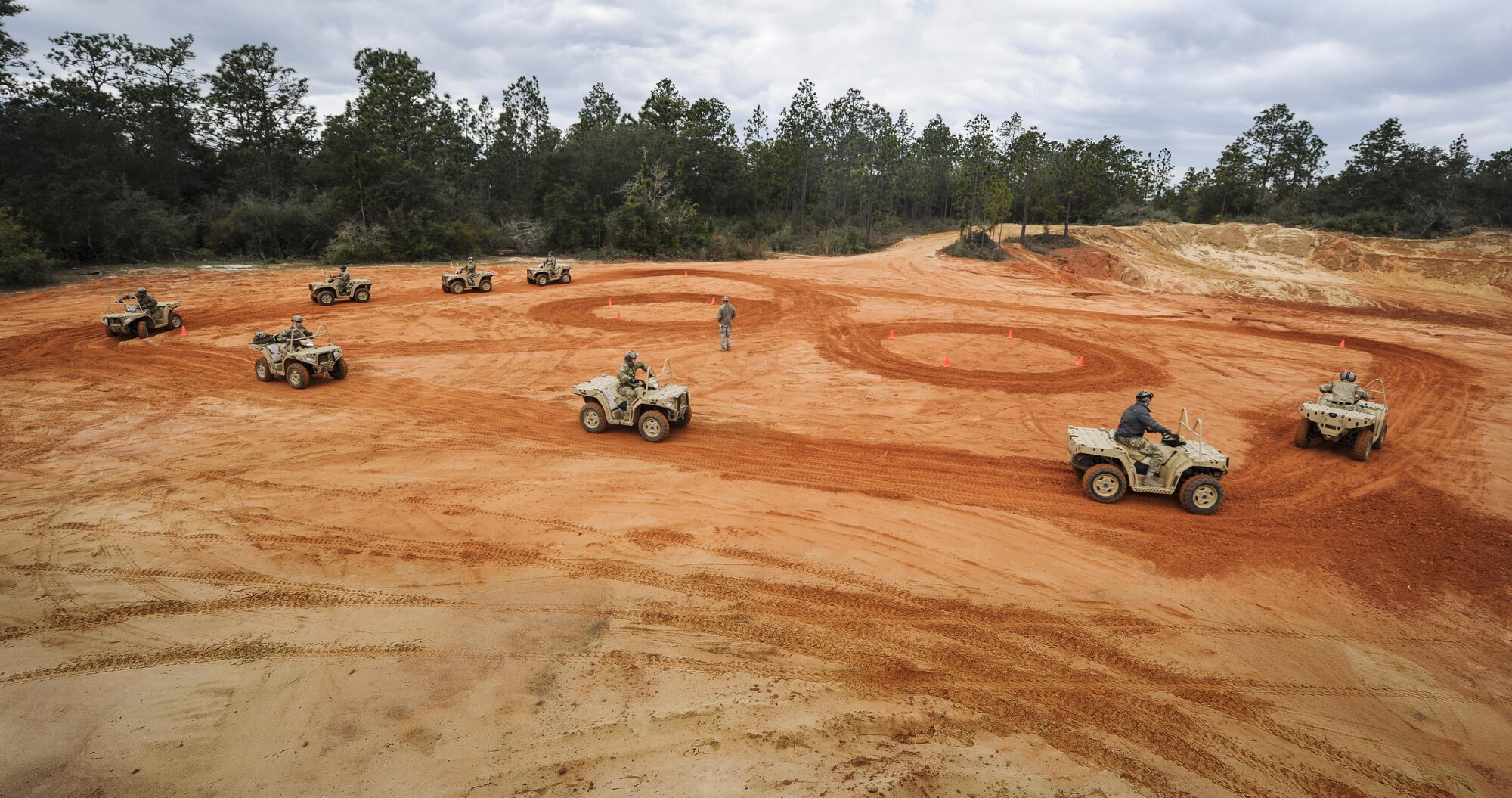 Soldiers with the 1st Battalion, 10th Special Forces Group, partnered with the 1st Special Operations Support Squadron Operational Support Joint Office to learn all-terrain vehicle techniques at Buck Pond in Navarre, Fla., March 14, 2017. The 1st SOSS/OSJ facilitates special operations forces training to ensure global readiness. (U.S. Air Force photo by Airman 1st Class Dennis Spain)