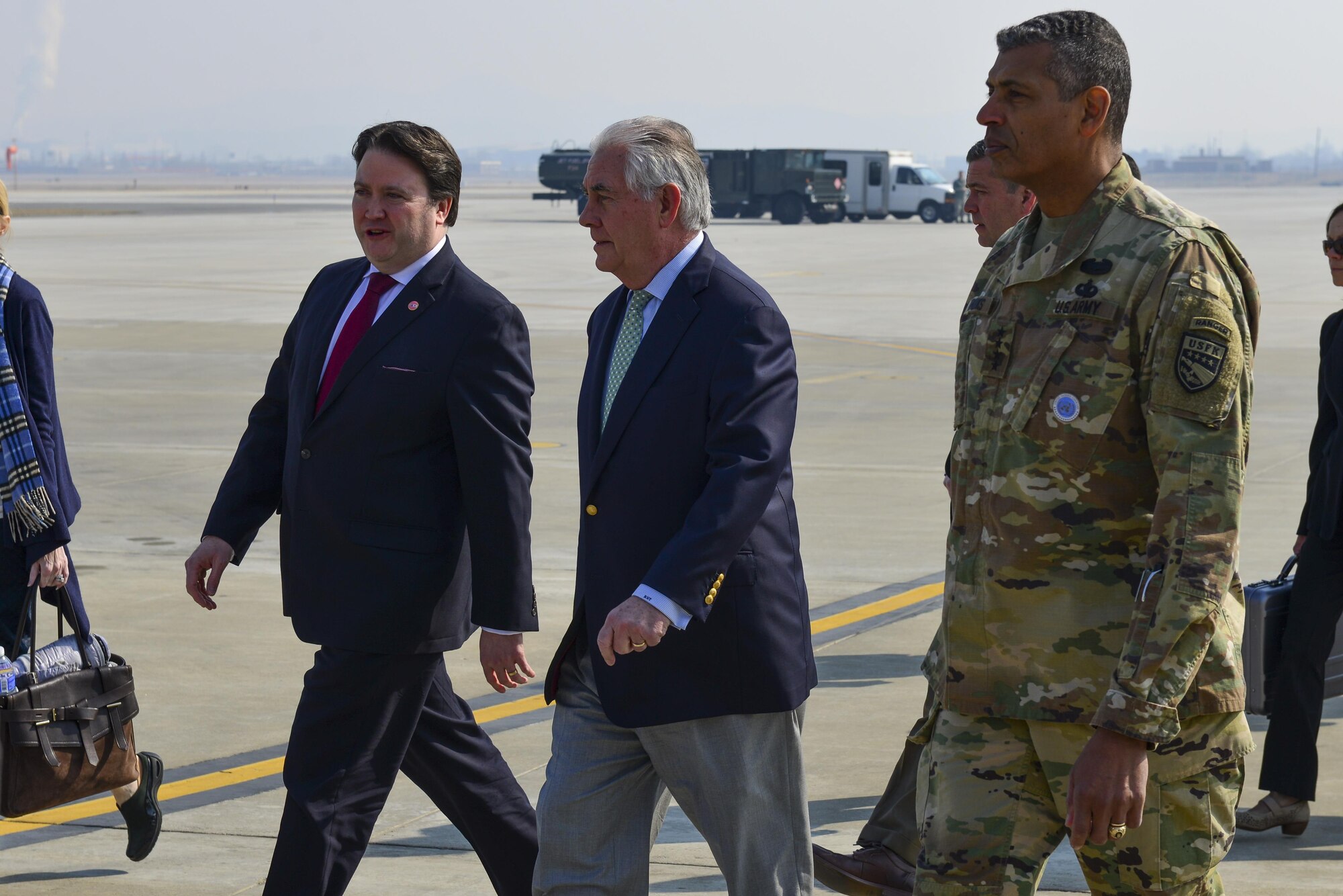 Marc Knapper, left, the Charge d'Affaires at the U.S. Embassy in Seoul, U.S. Secretary of State Rex Tillerson, and U.S. Army Gen. Vincent K. Brooks, United States Forces Korea commander, prepare to depart for an official visit to Seoul from Osan Air Base, Republic of Korea, March 17, 2017. Korea is one of three countries Tillerson is visiting during his first trip to the Pacific region as secretary of state, reiterating the United States' continued strong support of the U.S. - Korean alliance. (U.S. Air Force photo by Staff Sgt. Victor J. Caputo)