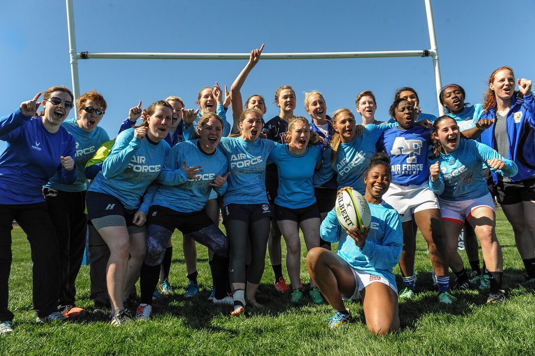 The Air Force women’s rugby sevens team huddles together after a practice.