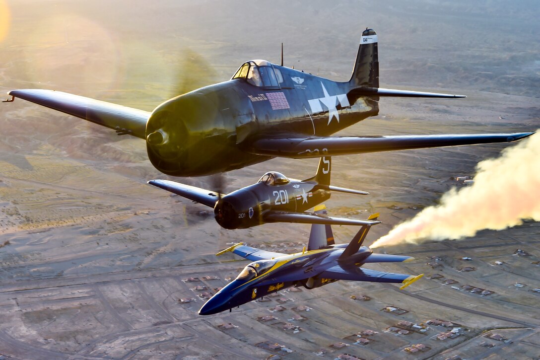 An F/A-18 Hornet with the Blue Angels, the Navy's flight demonstration squadron, flies over the Salton Sea in California with an F6F Hellcat and F8F Bearcat, March 9, 2017. The Hellcat and Bearcat were the first two aircraft models flown by the Blue Angels, shortly after the team’s inception in 1946. Navy photo by Petty Officer 2nd Class Ian Cotter