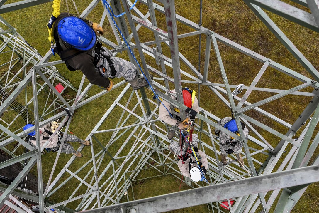Airmen participate in tower rescue and climbing training at Ramstein Air Base, Germany, March 9, 2017. The airmen are assigned to the 1st Communications Maintenance Squadron. Air Force photo by Senior Airman Tryphena Mayhugh