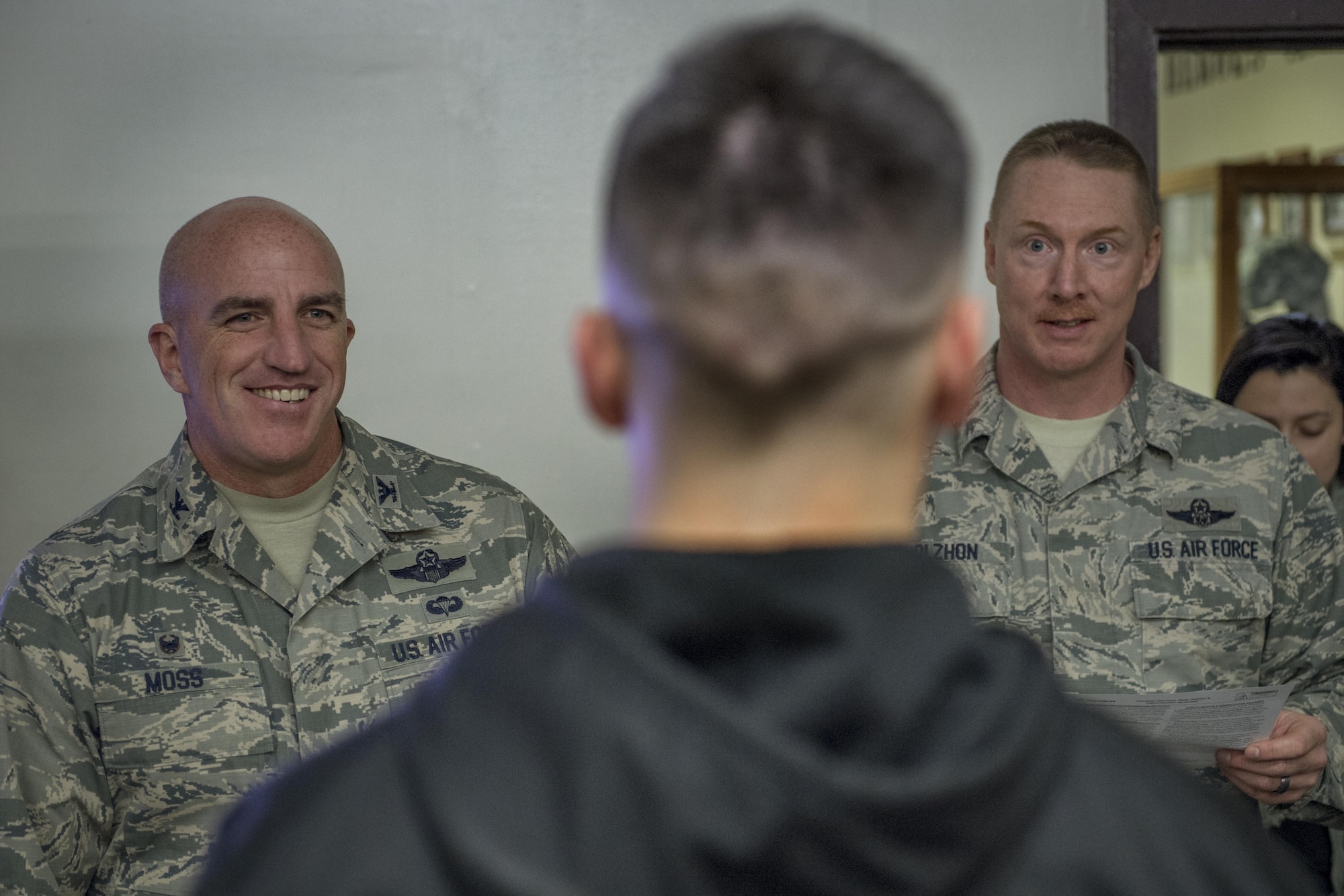 Col. Kenneth Moss, 374th Airlift Wing commander, and Chief Master Sgt. Michael L. Molzhon, 374th Operations Group superintendent, listen to a brief prior to being tased during a 374th Security Forces Squadron less-lethal weapons demonstration March 15, 2017, at Yokota Air Base, Japan. Moss volunteered to be part of the demonstration to experience and understand more of what SFS members go through and to show his support. (U.S. Air Force photo by Airman 1st Class Donald Hudson)
