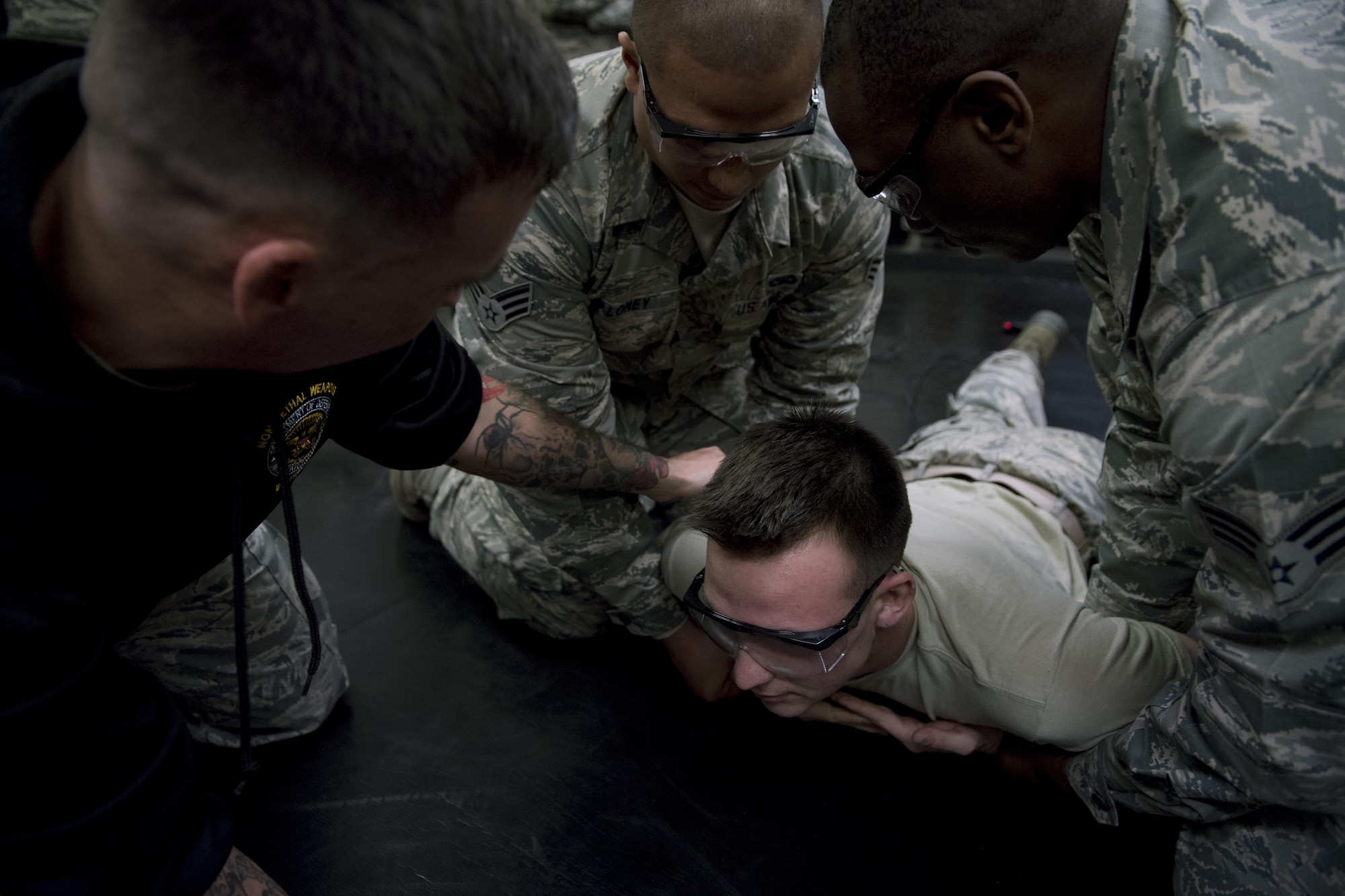 A 374th Security Forces Squadron member prepares to be tased during a less-lethal weapons demonstration, March 15, 2017, at Yokota Air Base, Japan. The demonstration was part of a course to qualify SFS members on the use and tactics of less-lethal weapons. (U.S. Air Force photo by Airman 1st Class Donald Hudson)