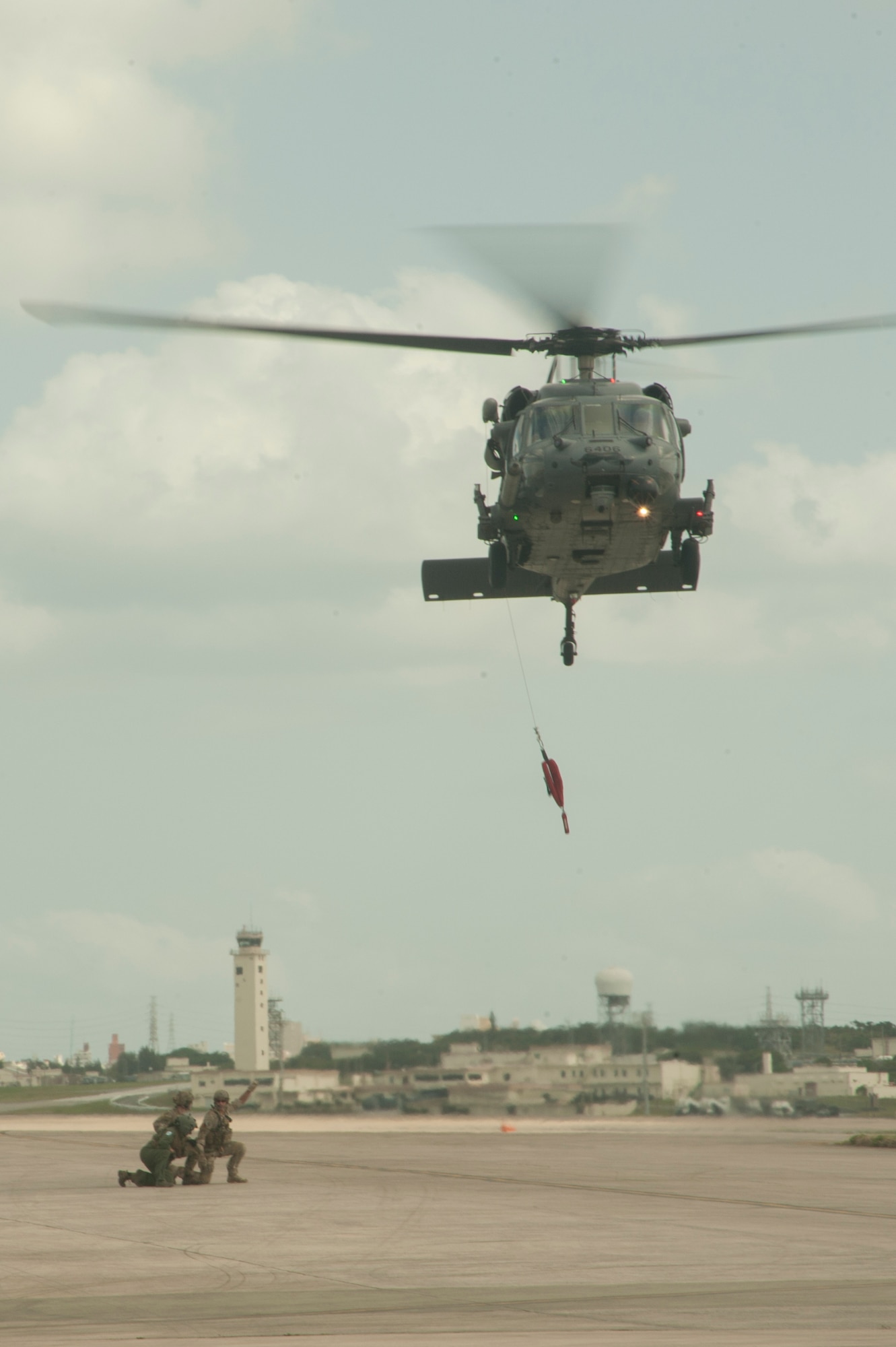 U.S. Air Force Airmen assigned to the 33rd Rescue Squadron demonstrate a fast-rope rescue March 15, 2017, at Kadena Air Base, Japan. Enlisted leaders across the services participated in a joint professional military education week, visiting multiple units across multiple services over the week. The joint aspect is designed to give those leaders a broadened perspective of what each branch is capable of. (U.S. Air Force photo by Airman 1st Class Quay Drawdy)