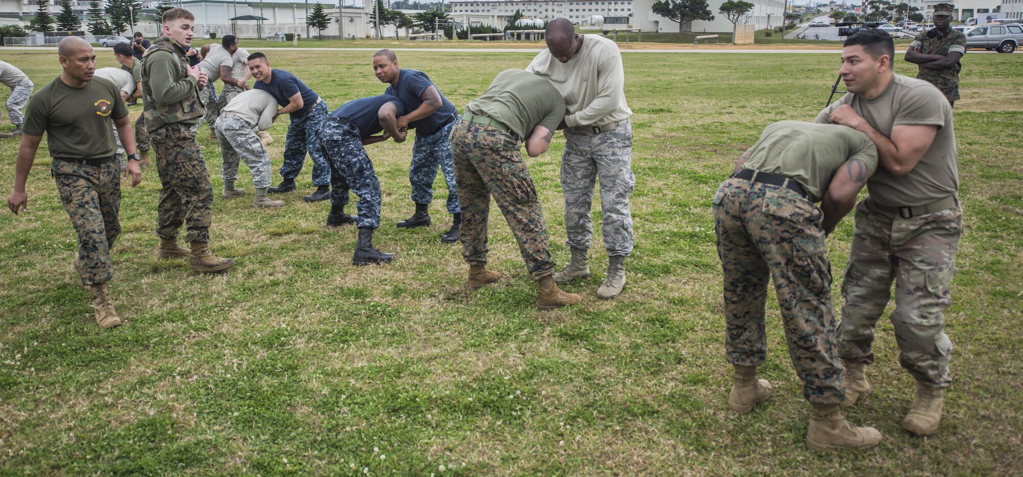 U.S. Military members from U.S. Marine Corps, U.S. Navy, U.S. Air Force, and U.S. Army practice Marine Corps martial arts program techniques as part of the Joint Okinawa Experience, a senior leadership professional military education class, March 16, 2017, on Camp Hansen, Japan. Five days of travelling and learning together gave each member an appreciation of their fellow service member and their component in the joint mission. (U.S. Air Force Photo by Senior Airman Nick Emerick) 