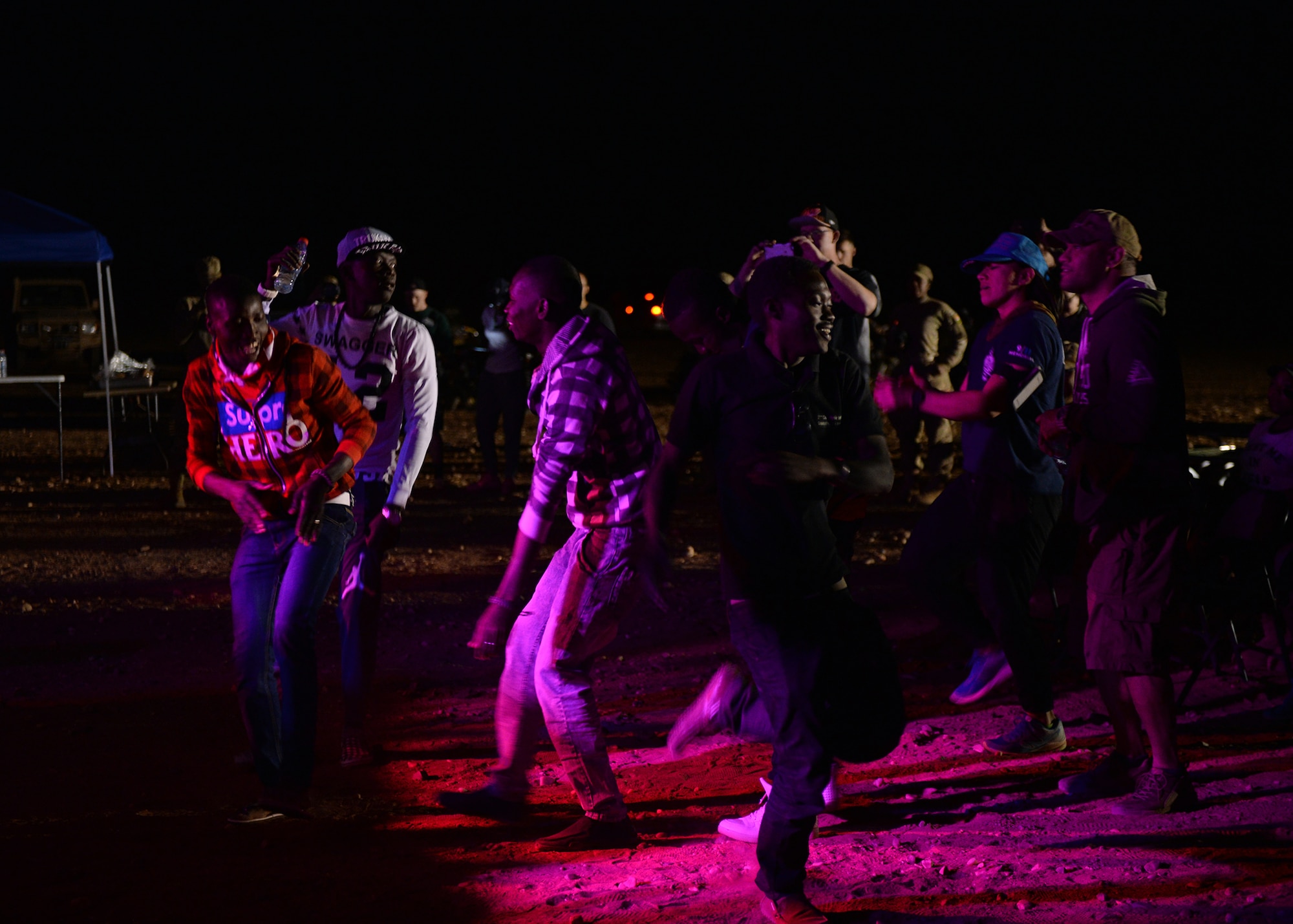 Members of the Forces Armées Nigeriennes dance during an entertainment event at Nigerien Air Base 201, Agadez, Niger, March 10, 2017. An ensemble of the United States Air Forces in Europe Band known as Touch ‘n Go performed for Airmen deployed to Niger as well as their counterparts. (U.S. Air Force photo by Senior Airman Jimmie D. Pike)