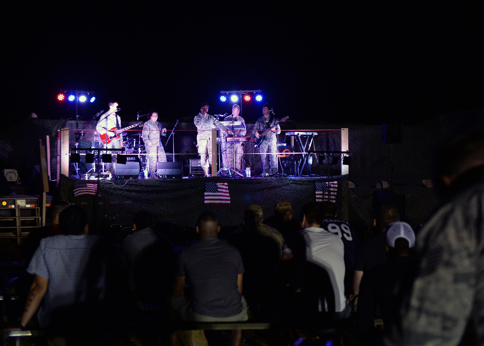 Deployed Airmen attend a band performance at Nigerien Air Base 201 Agadez, Niger, March 10, 2017. A United States Air Forces in Europe Band ensemble, known as Touch ‘n Go, performed the first musical entertainment event held at Air Base 201 to build Airmen morale and enhance military partnerships between the U.S. Air Force and Forces Armées Nigeriennes. (U.S. Air Force photo by Senior Airman Jimmie D. Pike)
