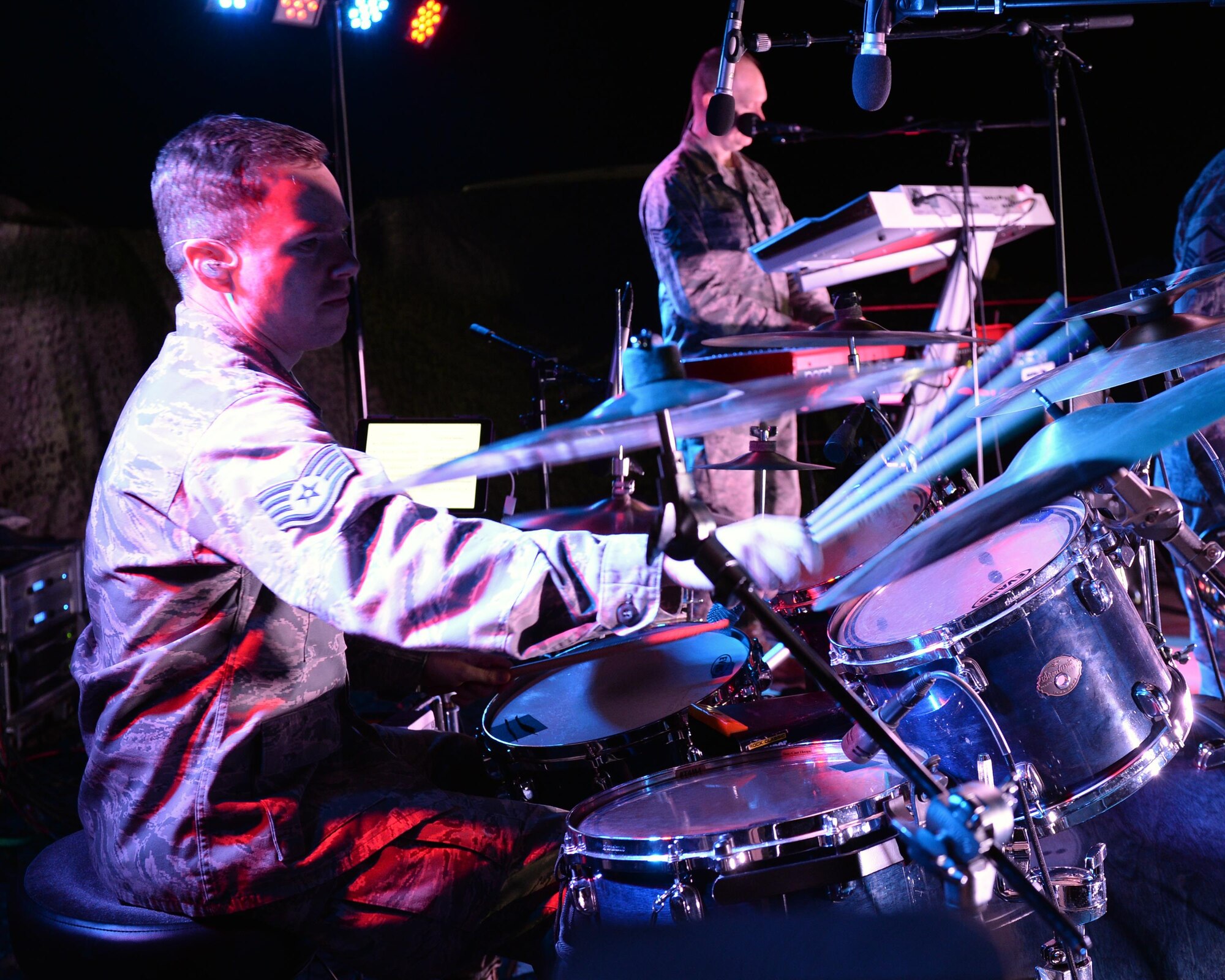 Staff Sgt. Mark Wheeler, United States Air Forces in Europe Band percussionist, plays the drums during a performance at Nigerien Air Base 201 near Agadez, Niger, March 10, 2017. An ensemble of the USAFE Band, known as Touch ‘n Go, performed for Airmen deployed to Niger as well as their counterparts in the Forces Armées Nigeriennes. (U.S. Air Force photo by Senior Airman Jimmie D. Pike)