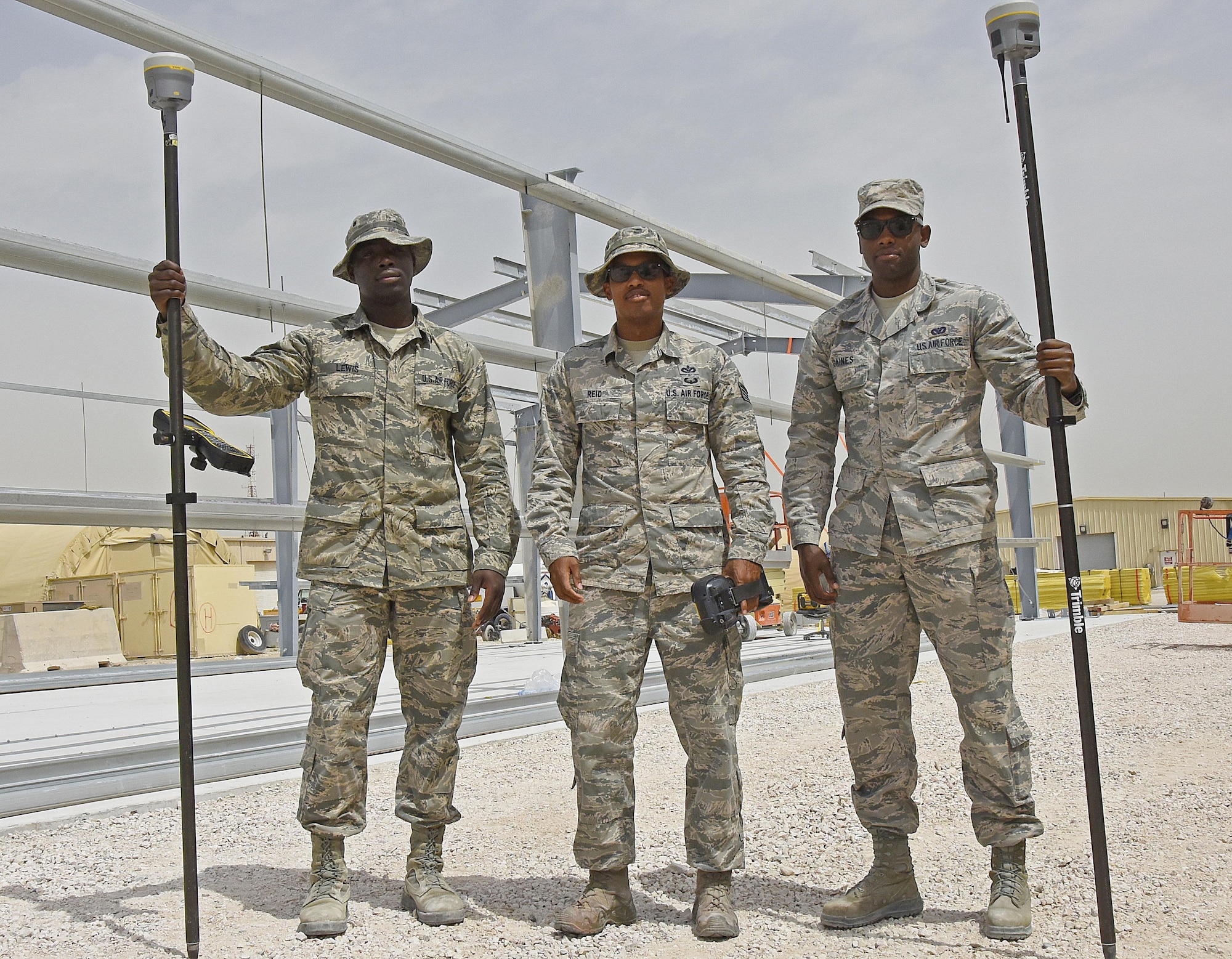 Engineer assistants with the 379th Expeditionary Civil Engineer Squadron GEOBASE section pose for a photo at Al Udeid Air Base, Qatar, March 15, 2017. Airmen with the GEOBASE section survey, map, draft and maintain common installation picture maps and have the ability to produce unit specific maps of Al Udeid AB.  (U.S. Air Force photo by Senior Airman Cynthia A. Innocenti)