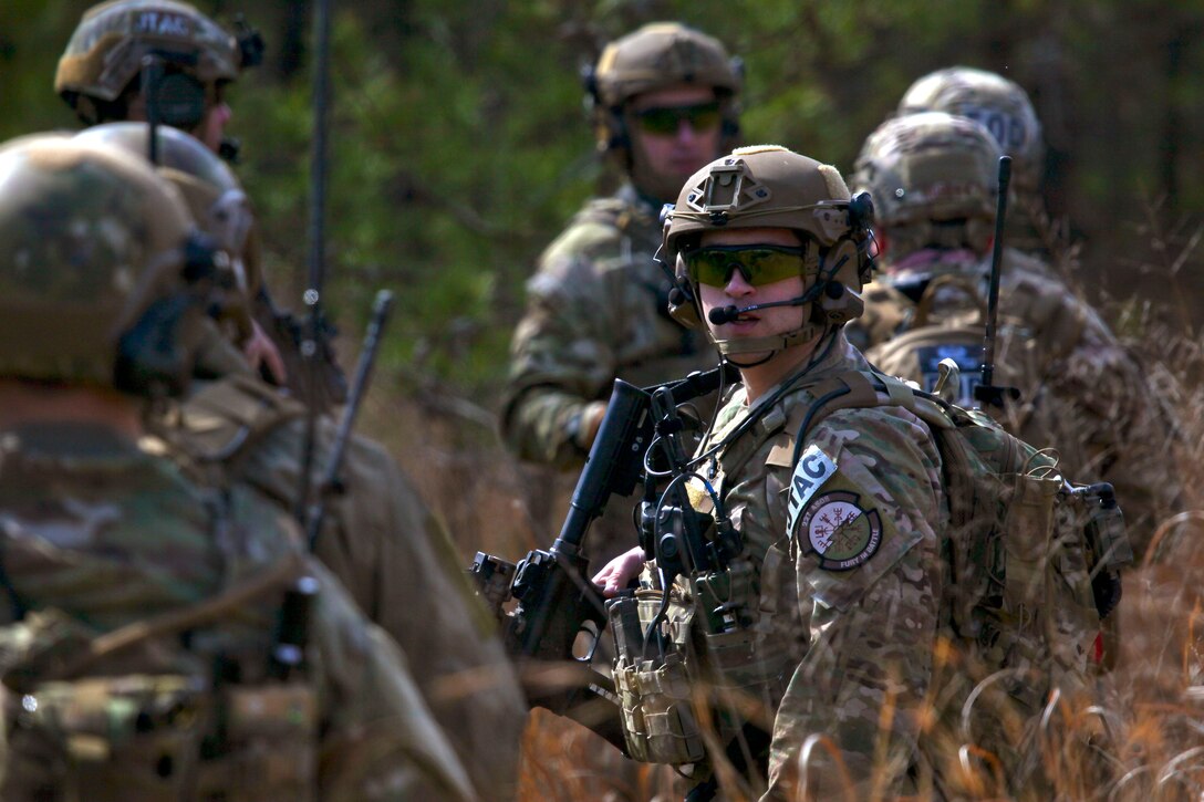 New Jersey Air National Guardsmen move out on patrol during an exercise at Warren Grove Gunnery Range, N.J., March 8, 2017. The guardsmen are tactical air control party airmen and explosive ordinance disposal technicians assigned to the New Jersey Air National Guard. Air National Guard photo by Master Sgt. Matt Hecht