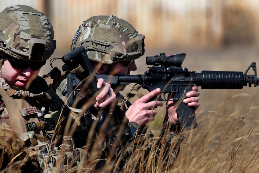 New Jersey Air National Guardsmen provide security before moving out to their follow-on position during an exercise at Warren Grove Gunnery Range, N.J., March 8, 2017. Air National Guard photo by Master Sgt. Matt Hecht