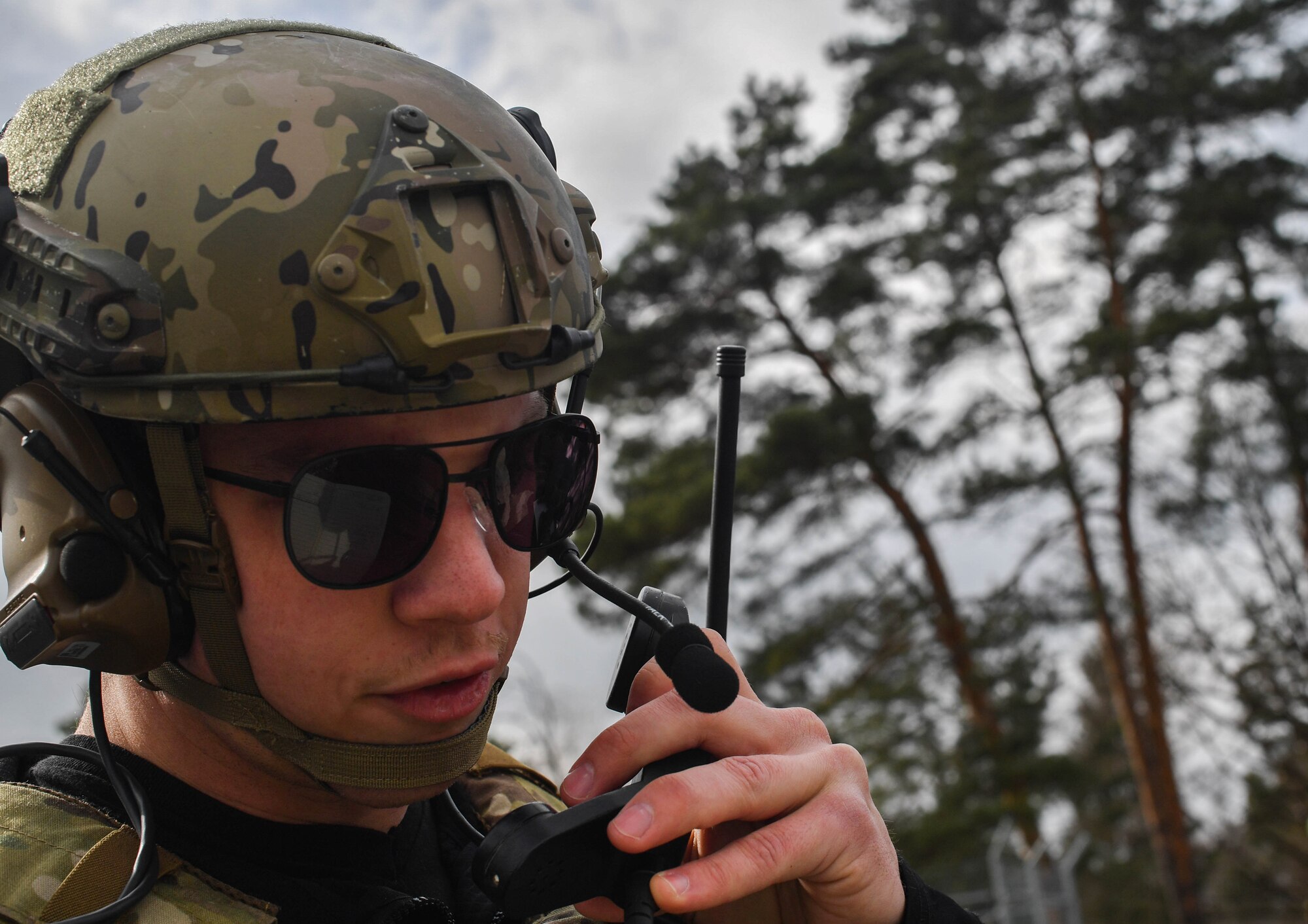 U.S. Air Force Senior Airman Jacob Hughes, 146th Air Support Operations Squadron tactical air control party, describes the location of a target to an A-4 Skyhawk pilot during the U.S. Air Forces in Europe Air-Ground Operations School’s Joint Terminal Attack Controller Qualification Course at Grafenwoehr Training Area, Germany, March 15, 2017. Once the pilot confirmed the location of the target, the students cleared the aircraft to proceed, upon which it either dropped live ammunition or did a dry run. (U.S Air Force photo by Senior Airman Tryphena Mayhugh)