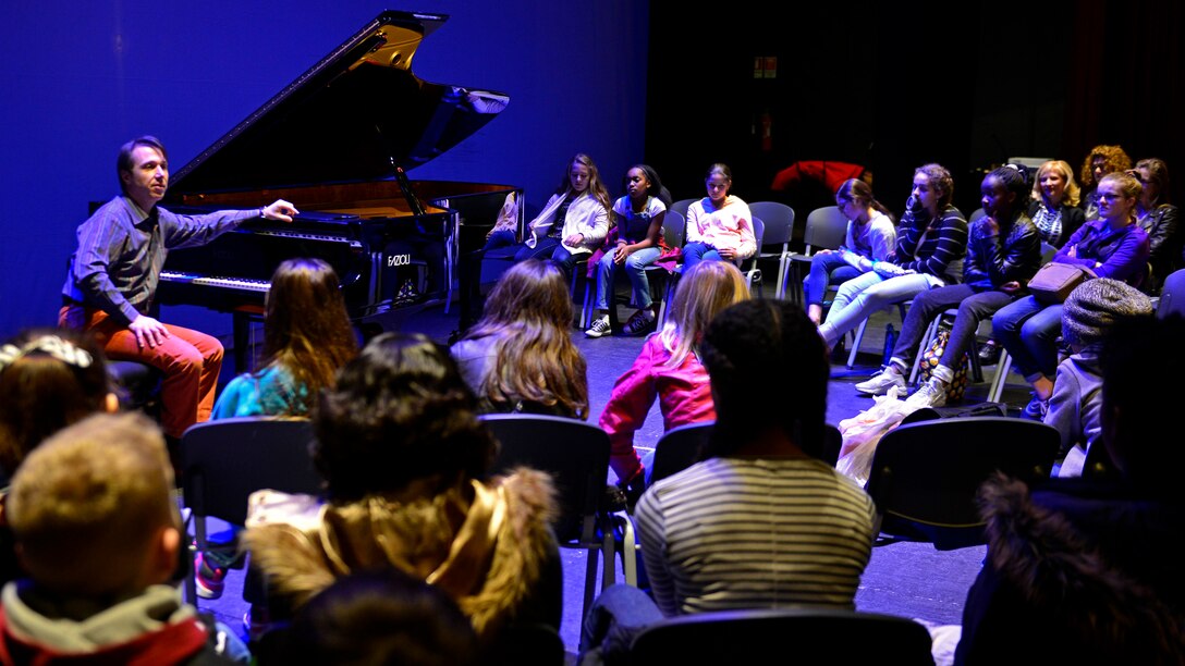 Maurizio Baglini, Italian pianist, speaks to an Aviano Middle High School sixth-grade class about classical music during their visit to the Pordenone Theater, March 10, 2017. Baglini played various compositions from Bach, Mozart and Beethoven during the student’s visit. (U.S. Air Force photo by Senior Airman Cary Smith)