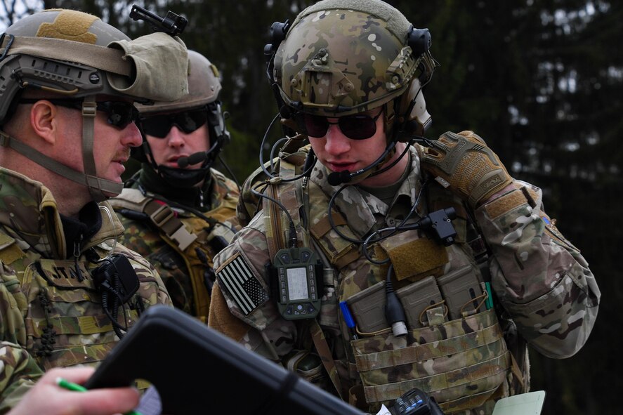 U.S. Air Force Master Sgt. Tom Moody, U.S. Air Forces in Europe Air-Ground Operations School squadron superintendent and joint terminal attack controller instructor, goes over information with U.S. Air Force Senior Airman Jacob Hughes, 146th Air Support Operations Squadron tactical air control party, during the USAFE AGOS’s JTAC Qualification Course at Grafenwoehr Training Area, Germany, March 15, 2017. The JTACQC is offered by the Warrior Preparation Center. (U.S Air Force photo by Senior Airman Tryphena Mayhugh)