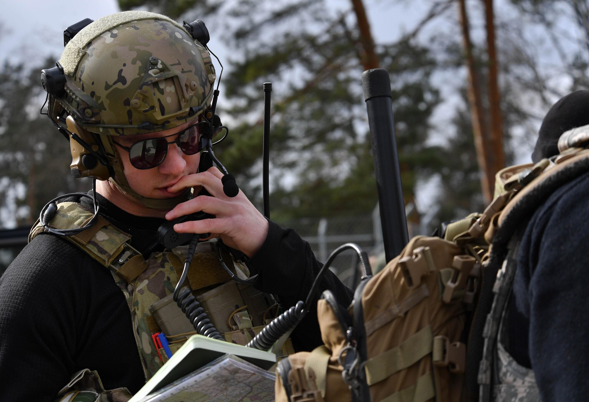 U.S. Air Force Senior Airman Jacob Hughes, 146th Air Support Operations Squadron tactical air control party, reviews the information he will relay to an A-4 Skyhawk pilot during the U.S. Air Forces in Europe Air-Ground Operations School’s Joint Terminal Attack Controller Qualification Course at Grafenwoehr Training Area, Germany, March 15, 2017. Hughes relayed all the information the pilot needed to locate and drop ammunition on a specific target. (U.S Air Force photo by Senior Airman Tryphena Mayhugh)