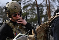 U.S. Air Force Senior Airman Jacob Hughes, 146th Air Support Operations Squadron tactical air control party, reviews the information he will relay to an A-4 Skyhawk pilot during the U.S. Air Forces in Europe Air-Ground Operations School’s Joint Terminal Attack Controller Qualification Course at Grafenwoehr Training Area, Germany, March 15, 2017. Hughes relayed all the information the pilot needed to locate and drop ammunition on a specific target. (U.S Air Force photo by Senior Airman Tryphena Mayhugh)