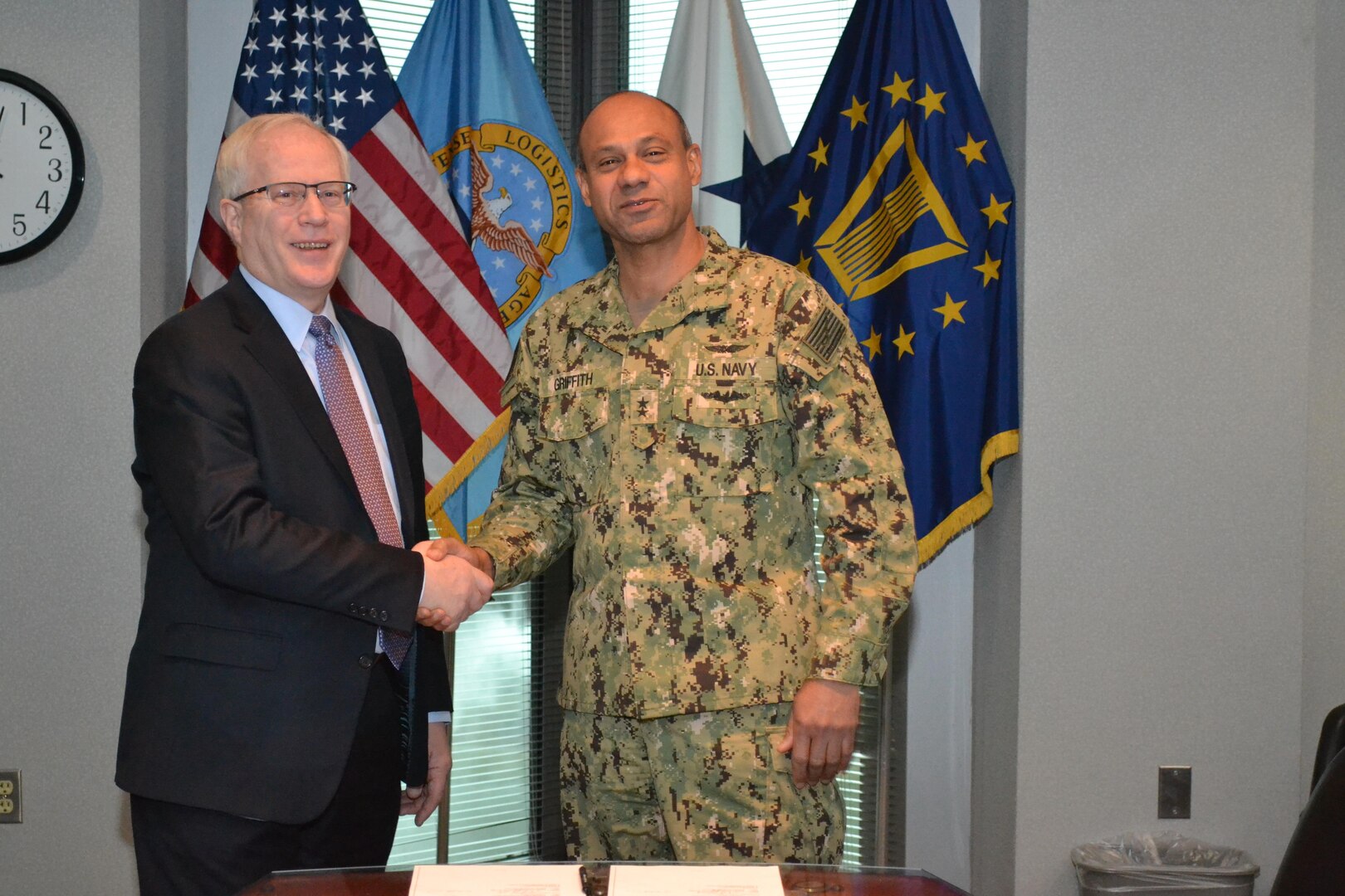 FEMA Assistant Administrator for Logistics Jeffrey Dorko (left) and DLA Logistics Operations Director Rear Adm. Vincent Griffith conclude an interagency agreement March 8 to facilitate DLA's continued support to FEMA during natural disasters.