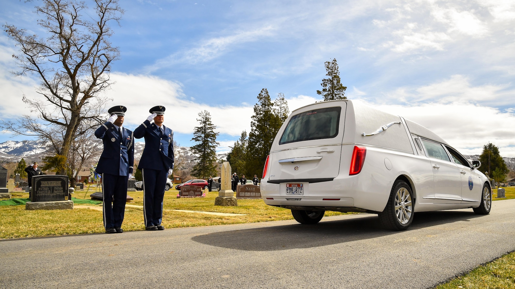 Hill AFB Honor Guard members Airman 1st Class Santos Vargas and Senior Airman James Fahrner render salutes as a hearse arrives during a veteran’s funeral service, Bountiful, Utah, March 8, 2017. Hill’s honor guard members provide professional military funeral honors for active duty, retired members and veterans. (U.S. Air Force photo/R. Nial Bradshaw)