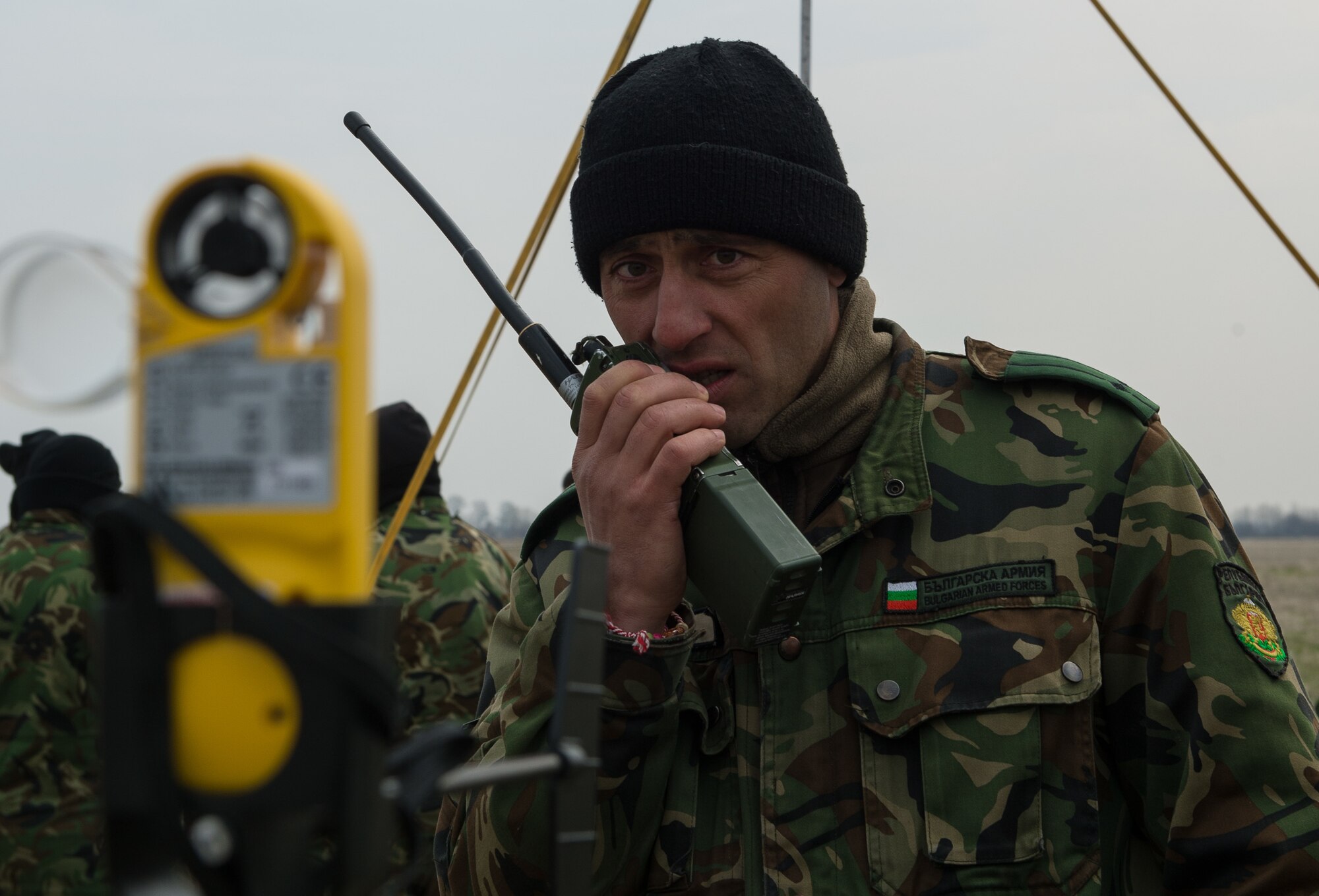 Lt. Col. Bozhider Boykov, Bulgaria’s Special Operations 1st Battalion, 86th Brigade commander, communicates wind readings from the drop zone to Bulgarian military pilots during Exercise Thracian Spring 17 at Plovdiv Regional Airport, Bulgaria, March 15, 2017. Boykov worked with a 435th Contingency Response Group drop zone controller throughout the two-week training to execute a safe personnel drop. The combined exercise aims to facilitate overall relations and build Bulgaria’s joint military capabilities. (U.S. Air Force photo by Staff Sgt. Nesha Humes)