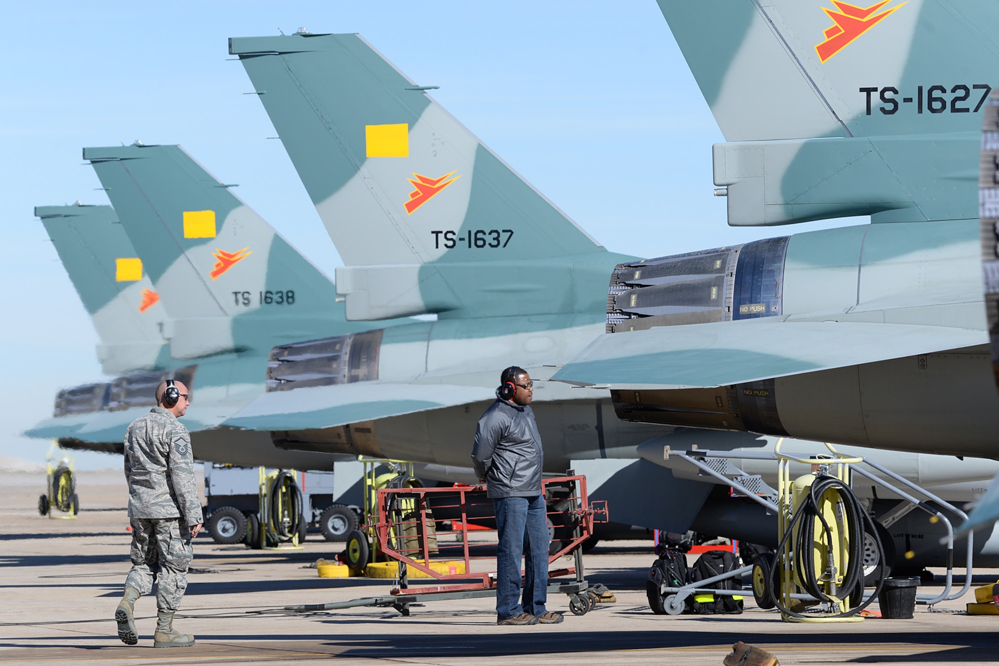 Ground crews walk around the Indonesian F-16 Fighting Falcon aircraft to ensure everthing is looking good prior to departure.  (U.S. Air Force Photo by Alex R. Lloyd)
