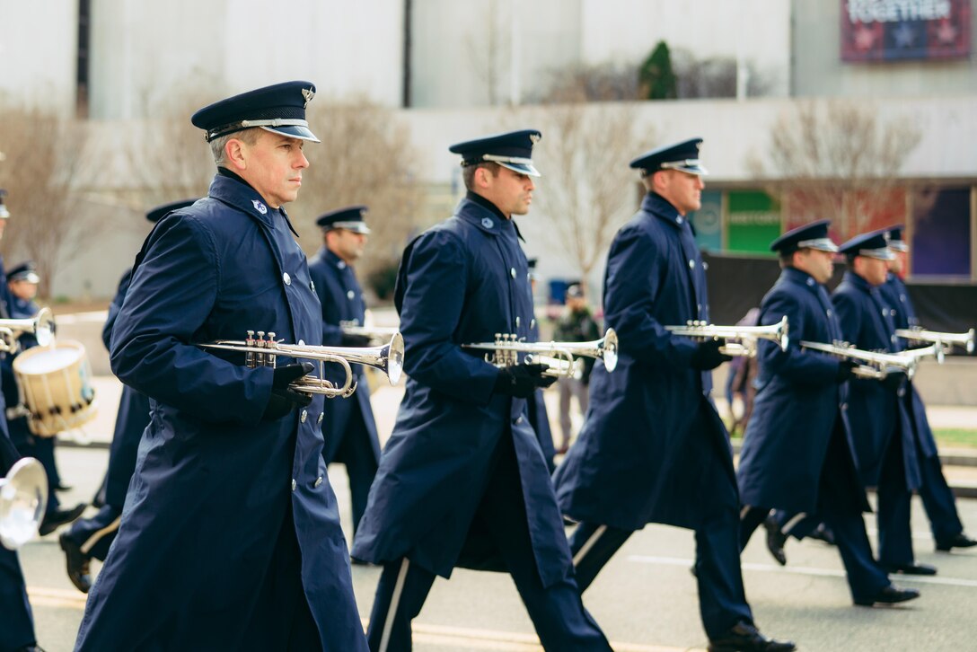Members of the U.S. Air Force Band march in the 46th Annual St. Patrick’s Day Parade in Washington, D.C., March 12, 2017. The band played for spectators along the parade’s Constitution Avenue route as part of its community relations mission. (U.S. Air Force photo by Senior Airman Delano Scott) 