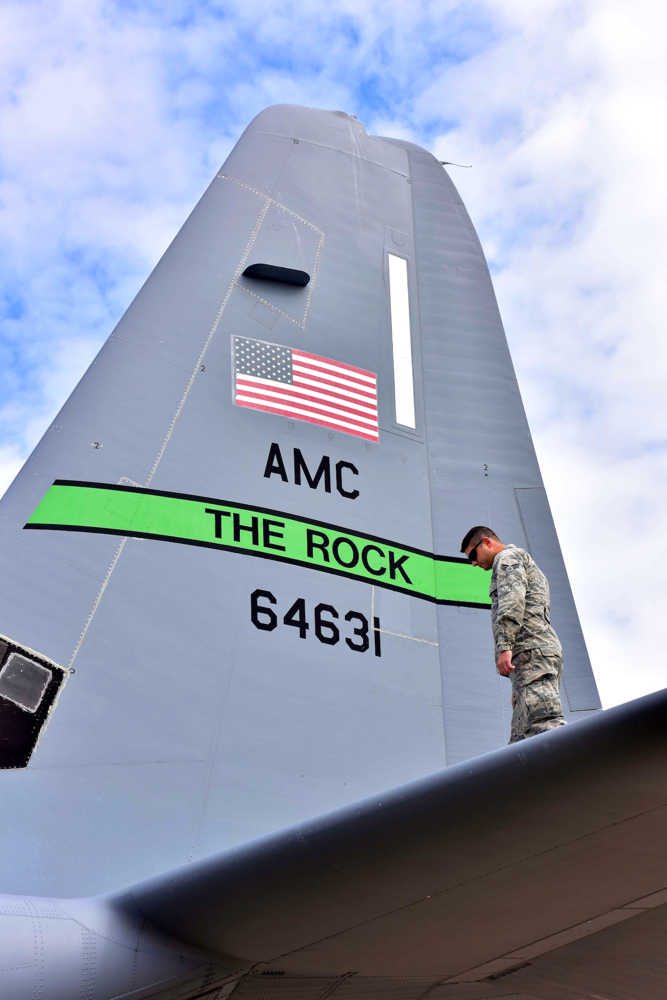 U.S. Air Force Senior Airman Nicholas Armitage, 19th Aircraft Maintenance Squadron crew chief, checks the top of the C-130J aircraft during pre-flight inspections March 15, 2017 at Little Rock Air Force Base. This C-130J was the first one delivered to AMC here at Little Rock a decade ago and is still providing combat airlift for Little Rock, AMC and the U.S. Air Force. (U.S. Air Force photo by Staff Sgt. Jeremy McGuffin)