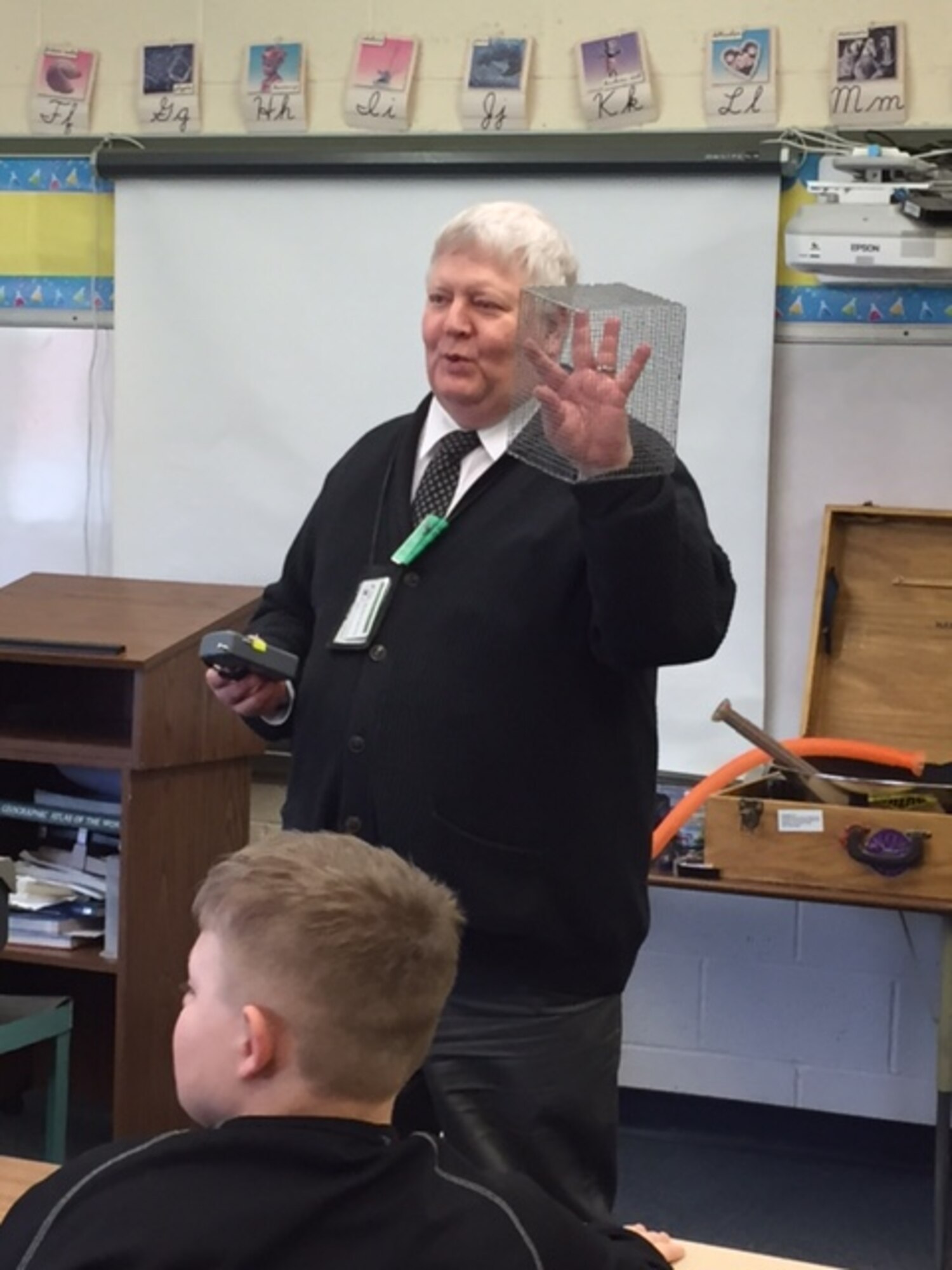Richard Strode, who is being recognized for his thousands of hours volunteering for the Educational Outreach Office at Wright-Patterson Air Force Base, Ohio, demonstrates how a Faraday cage works at Englewood Elementary School, Englewood, Ohio on March 10, 2017. (Courtesy photo)