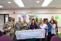 Mrs. Tierney Williams, center, 85th Support Command SHARP Victim Advocate, pauses for a photo with members from the 85th SPT CMD during a baby shower luncheon for Williams, Mar. 15, 2017. 
(Photo by Mr. Anthony L. Taylor)