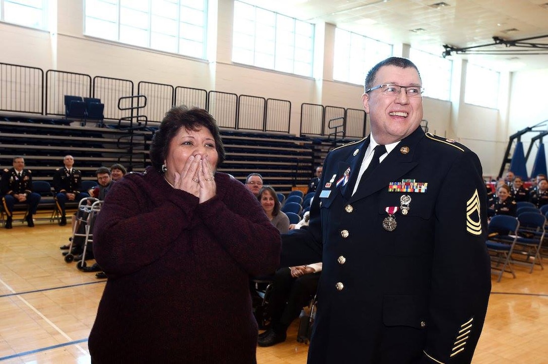 Army Reserve Master Sgt. Barry Jucha, 85th Support Command, with his wife, react to their son's surprise attendance at Jucha's retirement ceremony, Jan. 7, 2017. Jucha's son, Frank, who is stationed in Naples, Italy with the U.S. Navy, made a surprise visit to see his father Jucha retire with more than 21 years of service in the U.S. Army.
(Photo by Sgt. Aaron Berogan)