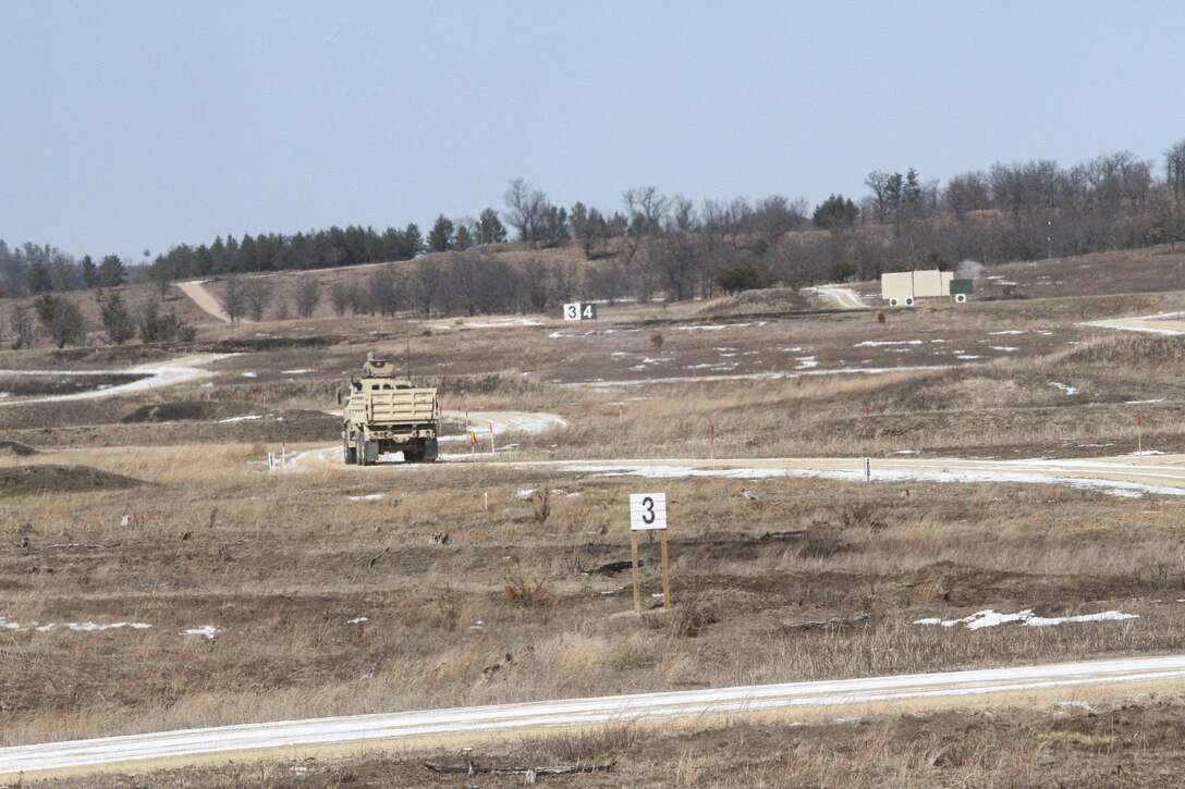 FORT MCCOY, Wis. - U.S. Army Reserve Soldiers with 327th Engineer Company, 416th 
Theater Engineer Command, fire at a vehicle target while completing gunnery table four using an M1157 Ten Ton Dump Truck for what may be the first time during Operation Cold Steel at Fort McCoy, Wis., March 15, 2017. Operation Cold Steel is the U.S. Army Reserve's crew-served weapons qualification and validation exercise to ensure that America's Army Reserve units and soldiers are trained and ready to deploy on short-notice and bring combat-ready and lethal firepower in support of the Army and our joint partners anywhere in the world. (U.S. Army Reserve photo by Staff Sgt. Debralee Best, 84th Training Command)
