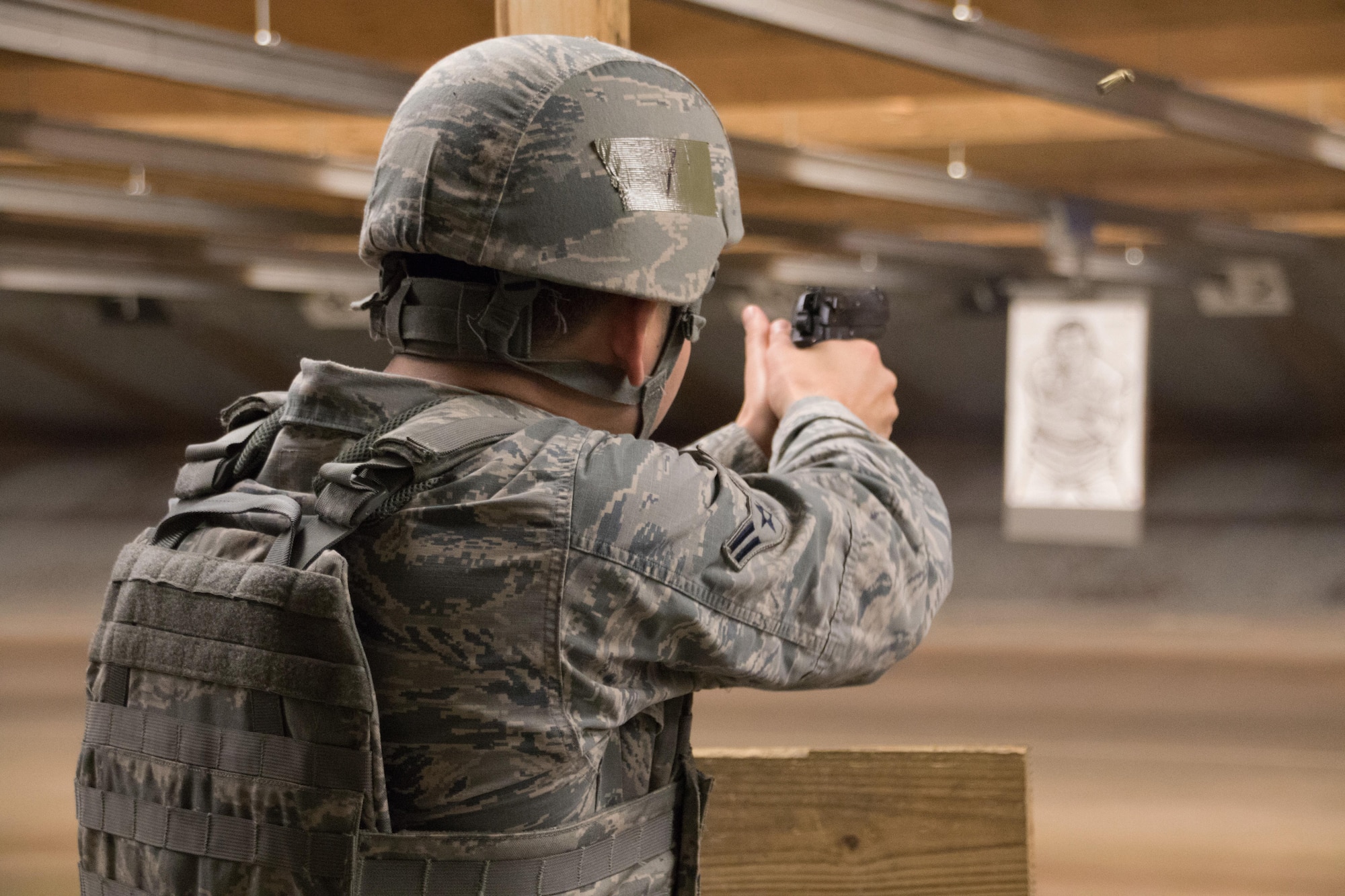 U.S. Air Force Airman 1st Class Johnny Guel, 7th Security Forces member, fires a M9 during the Top Defender Challenge March, 11, 2017, at Dyess Air Force Base, Texas. During the challenge participants were graded on their firing abilities on the M9 and the M4. (U.S. Air Force Photo by Tricia Bruton)