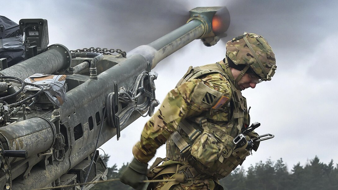 Army Spc. Vincent Ventarola pulls the lanyard on a M777 howitzer during a live-fire exercise as part of Dynamic Front II at the 7th Army Training Command's Grafenwoehr Training Area, Germany, March 9, 2017. Ventarola is assigned to the Field Artillery Squadron, 2nd Cavalry Regiment. Army photo by Gertrud Zach