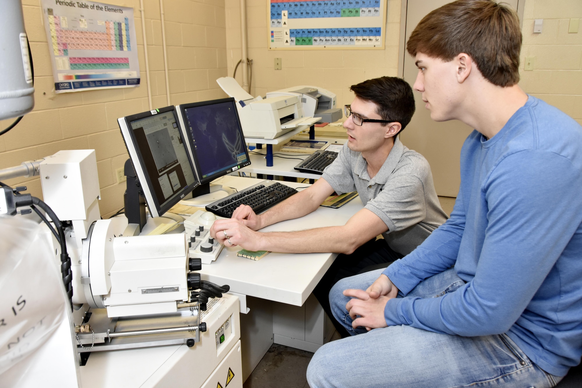 AEDC engineer Rylan Cox demonstrates the operation of an electron microscope to Franklin County High School student Collin Milliken he mentored as part of the Engineer for a Day program Feb. 22 at Arnold Air Force Base. Engineer for a Day, one of several 2017 Engineers Week activities during the week of Feb. 19-25, was held for area high school eleventh and twelfth grade students. After touring test facilities at the Complex, the group of 39 students had the chance to spend time with an engineer mentor in an area of their particular interest. (U.S. Air Force photo/Rick Goodfriend)