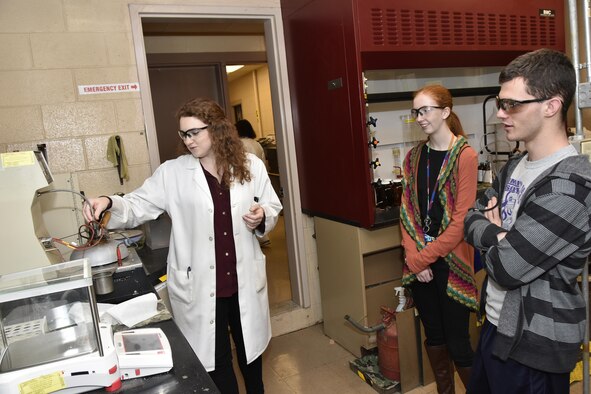 As part of the Engineers Engineer for a Day activities Feb. 22, AEDC analyst Mary Forde, pictured left, explains flash point testing to students interested in Chemical Engineering. Visiting the AEDC Chemistry Laboratory are, pictured at right, Fayetteville High School student Kaytlin Hobbs and Community High School student Brandon Waller. (U.S. Air Force photo/Rick Goodfriend)