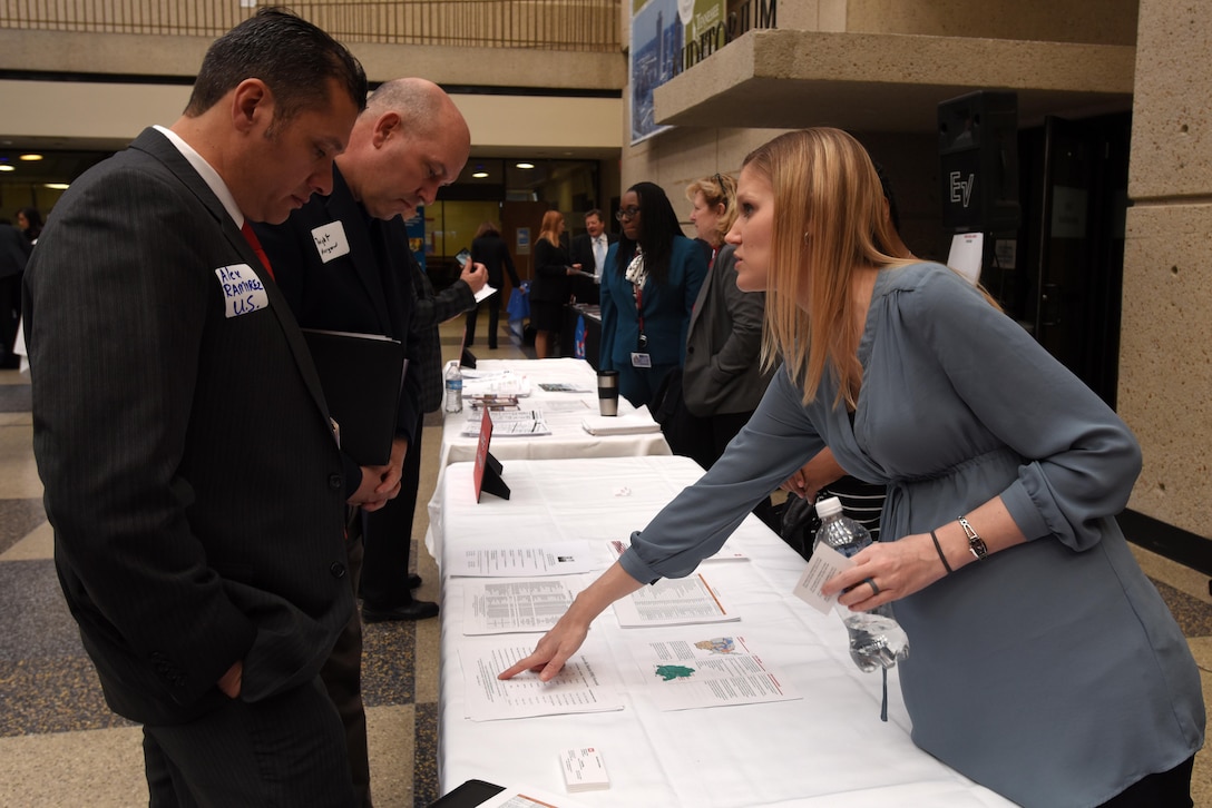 Crystal May, deputy for Small Business with the U.S. Army Corps of Engineers Louisville District, assists Alex Ramirez during the 6th Annual Small Business Industry Day at the Tennessee Small Business Development Center at Tennessee State University in Nashville, Tenn.