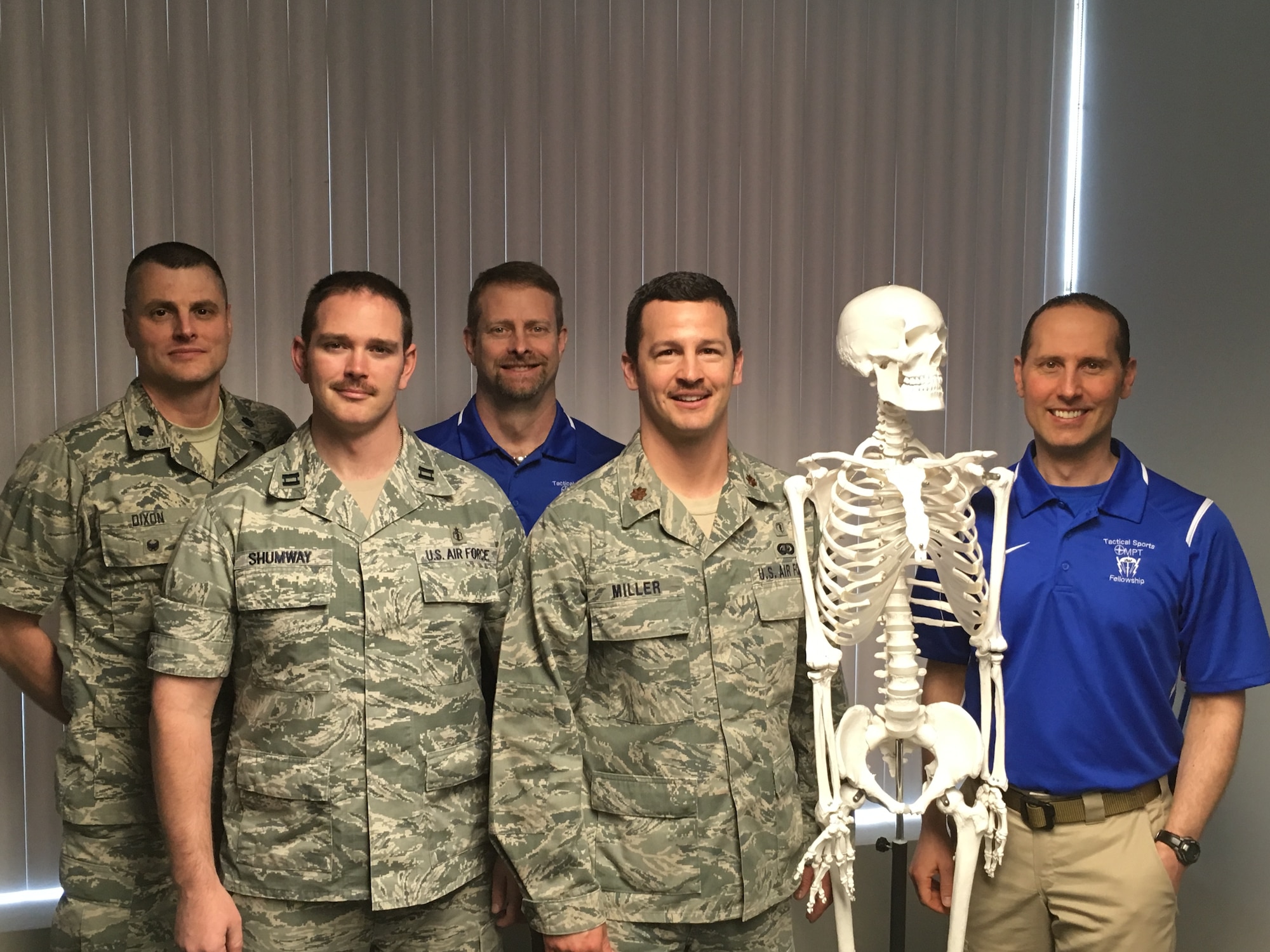 The Air Force Tactical Sports and Orthopedic Manual Physical Therapy Fellowship staff, faculty and current fellows. From left to right: Lt. Col. Joel Dixon (Assistant Fellowship Program Director), Capt. (Dr.) Joshua Shumway (Fellow in Training), Dr. Eric Wilson (Fellowship Program Director), Maj. (Dr.) Ronald Miller (Fellow in Training), Dave The Skeleton (Fellowship Senior Training Aid), Dr. Derek Vraa (Fellowship Senior Faculty Member)